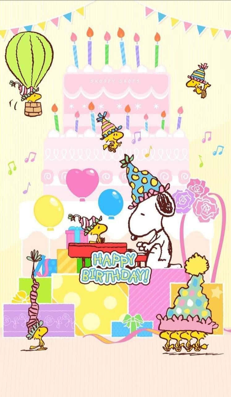 Charlie Brown Birthday 桌布 壁紙 — 史努比和朋友們用巨大的蛋糕、蠟燭、氣球和熱氣球在色彩繽紛的卡通場景中慶祝快樂的生日。