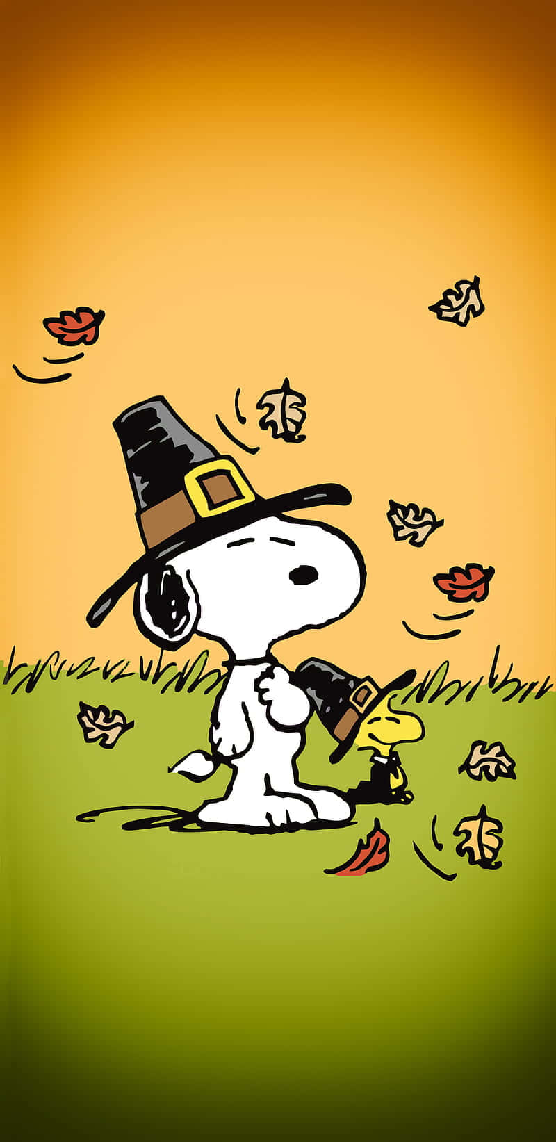 Snoopy Thanksgiving 桌布 壁紙 — 史努比和胡士托戴著朝聖者帽子，在溫暖的橙色天空下，草地上落下的秋葉中。
