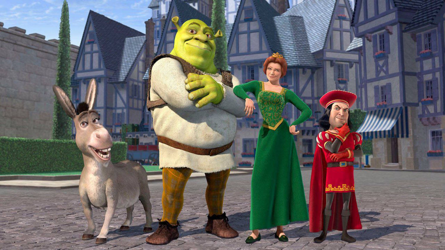 Lord Farquaad 桌布 壁紙 — 史瑞克、費歐娜和法奎德勳爵與驢子站在一個有半木結構房屋的鵝卵石小鎮廣場上。