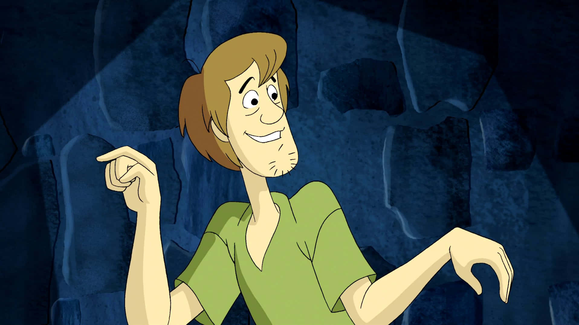 Shaggy Rogers 桌布 壁紙 — 史酷比在一個黑暗的洞穴中興奮地指著，身後是藍色的岩壁。