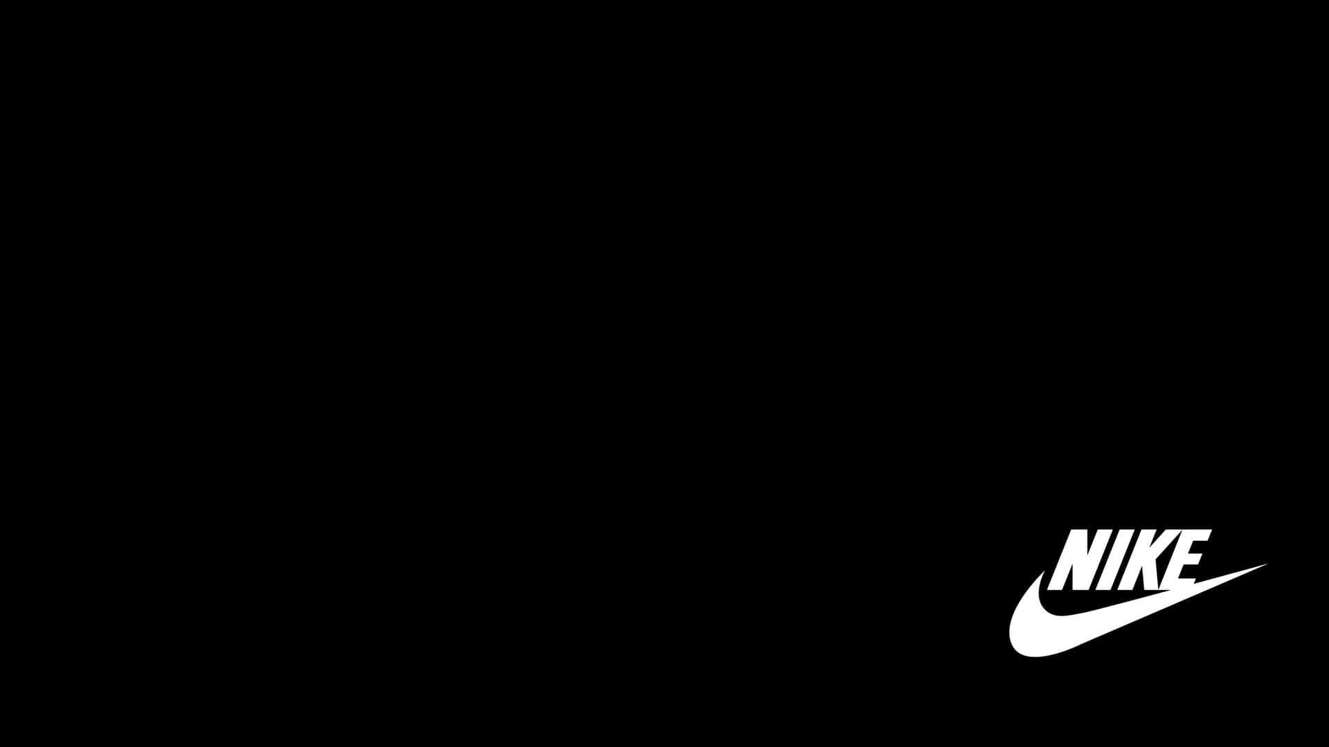 Nike Logo 桌布 壁紙 — 右下角帶有白色Nike Swoosh標誌的簡約黑色背景。