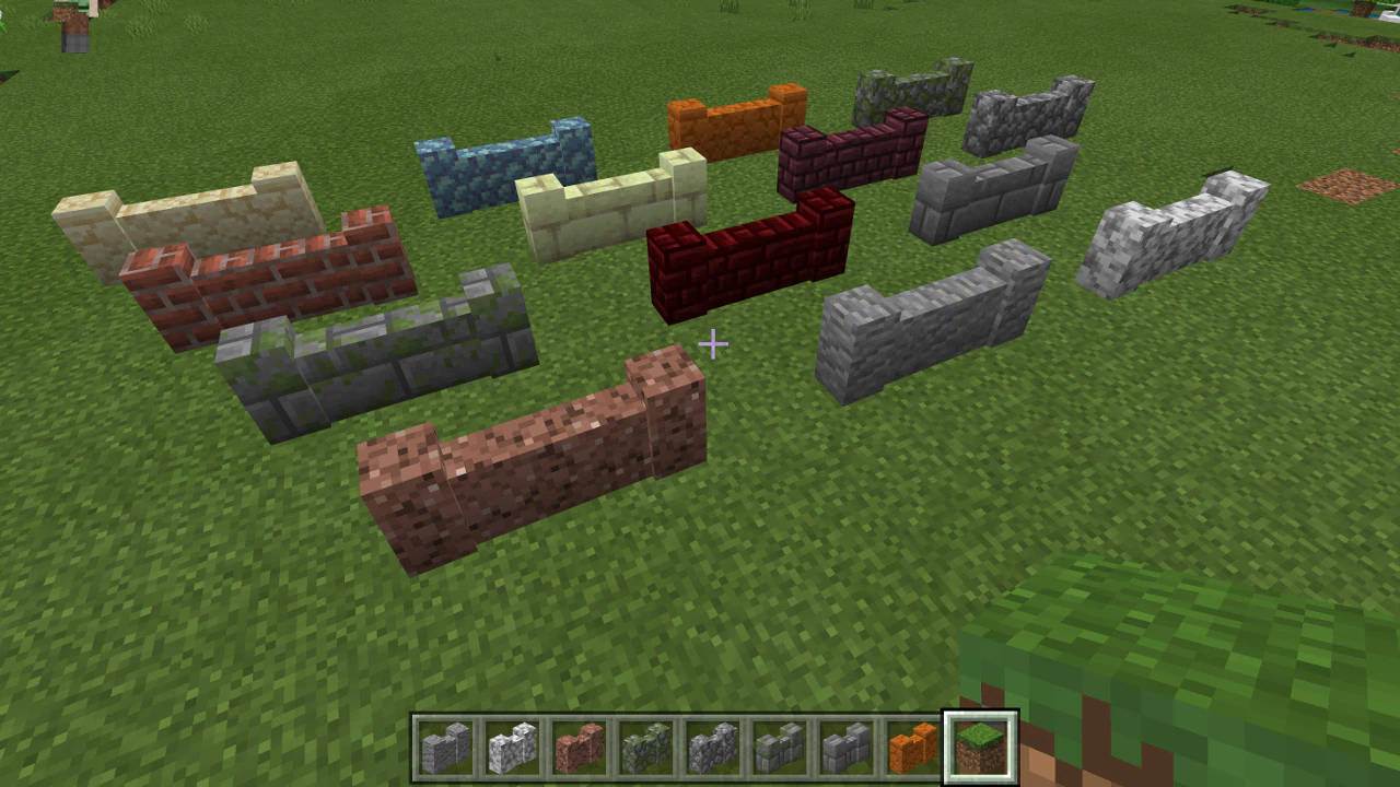 草地上多種顏色和材質的Minecraft圍欄方塊。