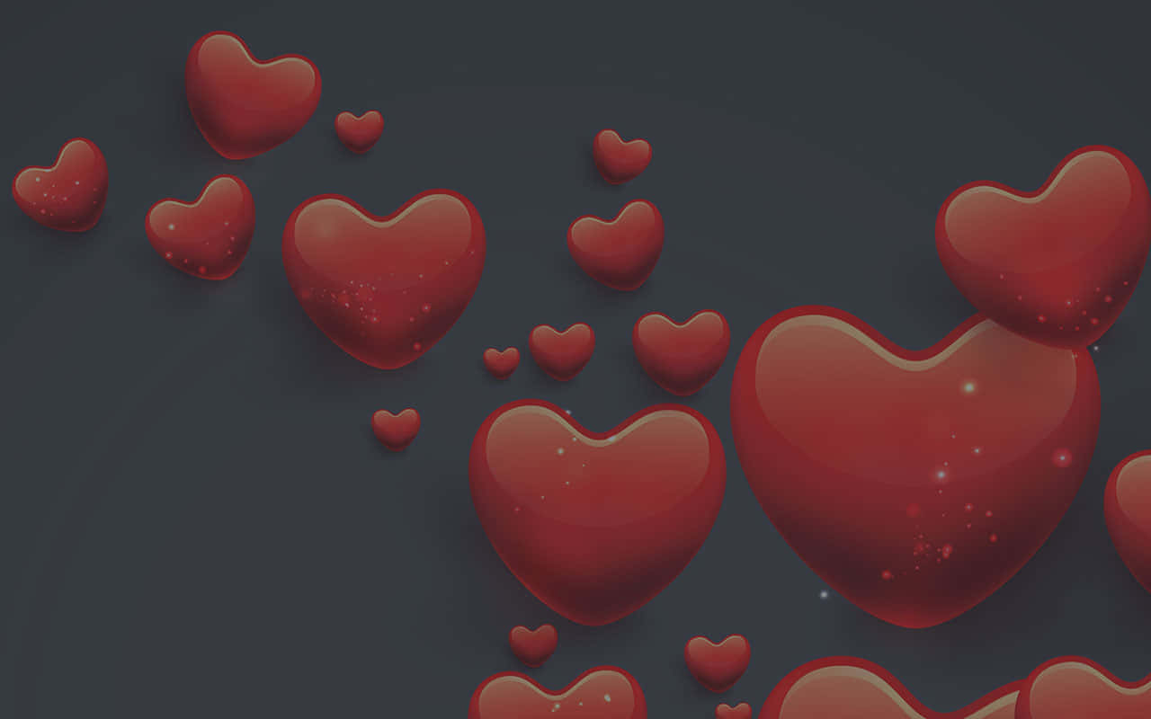 valentine 桌布 壁紙 — 各種尺寸的光澤紅色心形在帶有微妙閃爍的深灰色背景上輕輕漂浮。