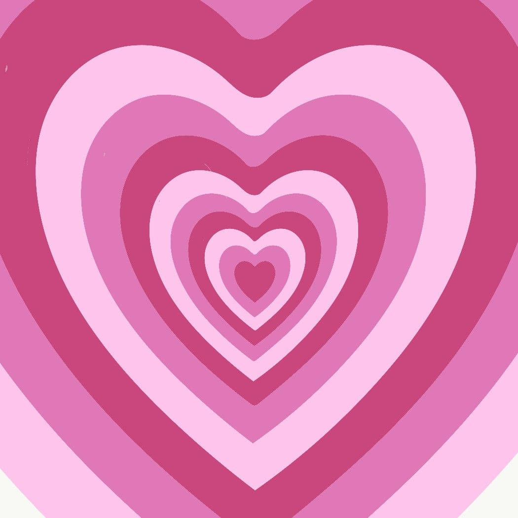 Y2k Heart 桌布 壁紙 — 各種粉紅色調的同心愛心圖案，營造出催眠般的視覺效果。