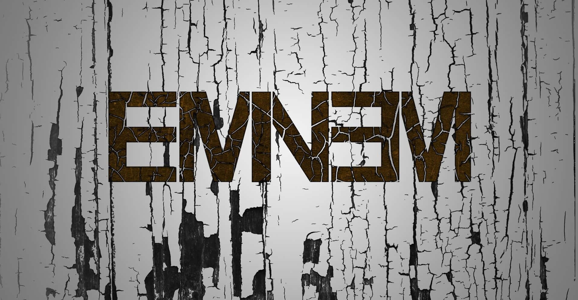 阿姆 桌布 壁紙 — 名字 EMINEM 以粗體裂紋字體出現在一面風化灰色、油漆剝落的牆上。