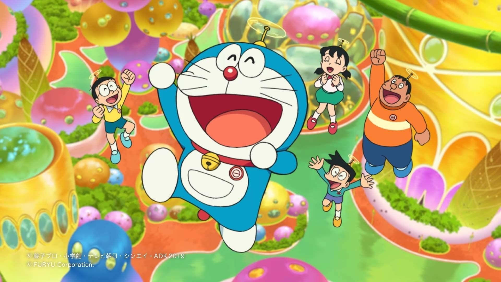 Doraemon 桌布 壁紙 — 哆啦A夢和他的朋友們愉快地跳躍穿過一個充滿巨型糖果的鮮豔糖果色幻想景觀。