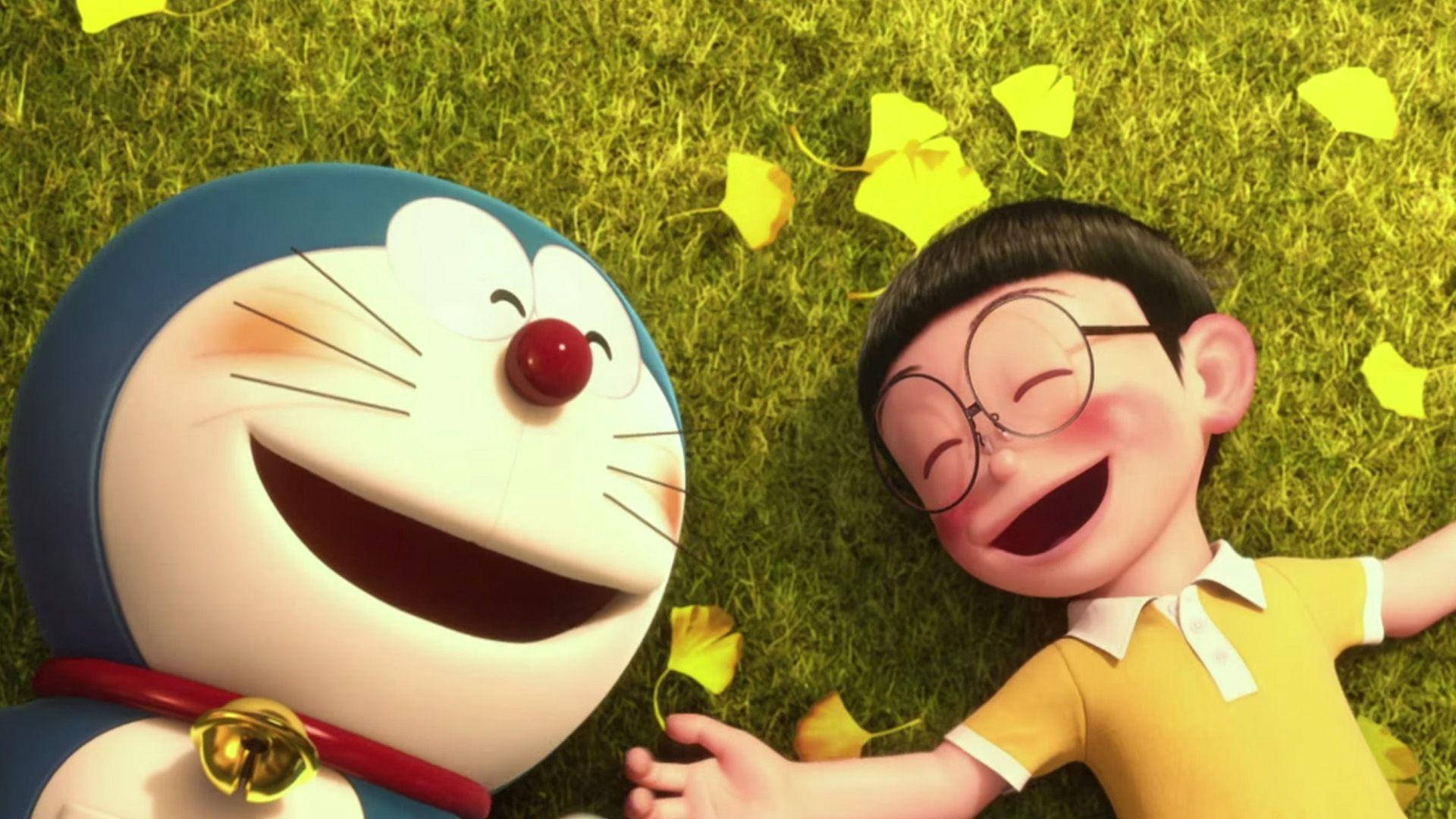Doraemon And Nobita 桌布 壁紙 — 哆啦A夢和大雄在散落黃葉的草地上一起開懷大笑。