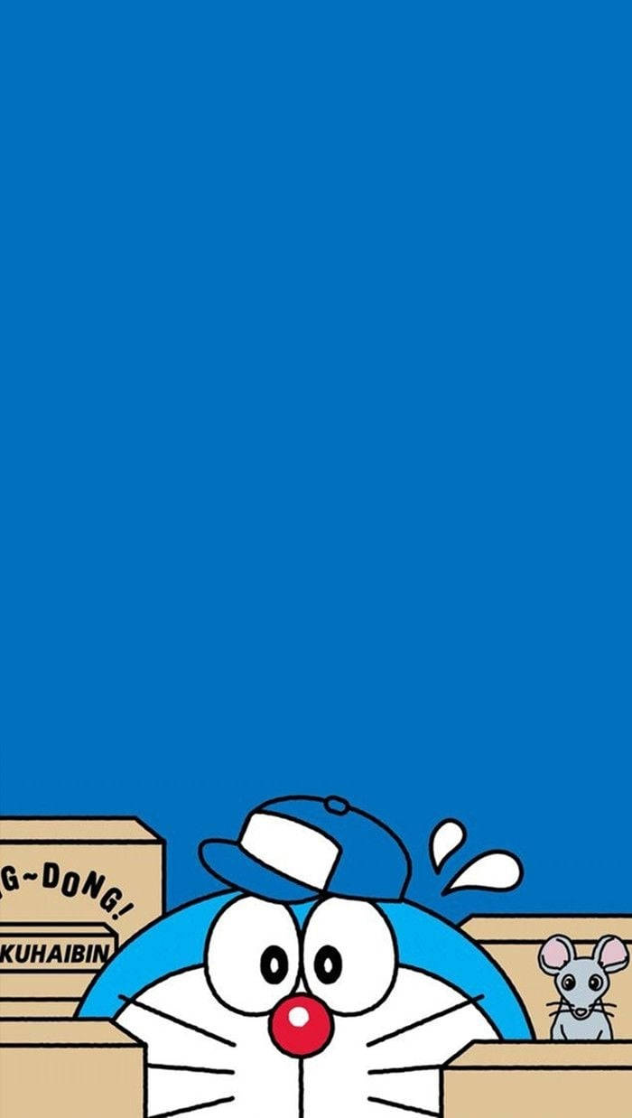 Doraemon 桌布 壁紙 — 哆啦A夢在純藍色背景上，以驚訝表情從紙箱上方探頭。