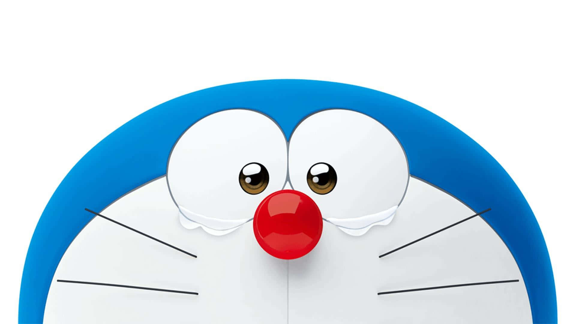 Doraemon 桌布 壁紙 — 哆啦A夢開心臉部特寫，有大眼睛、紅鼻子和藍色頭部，白色背景。