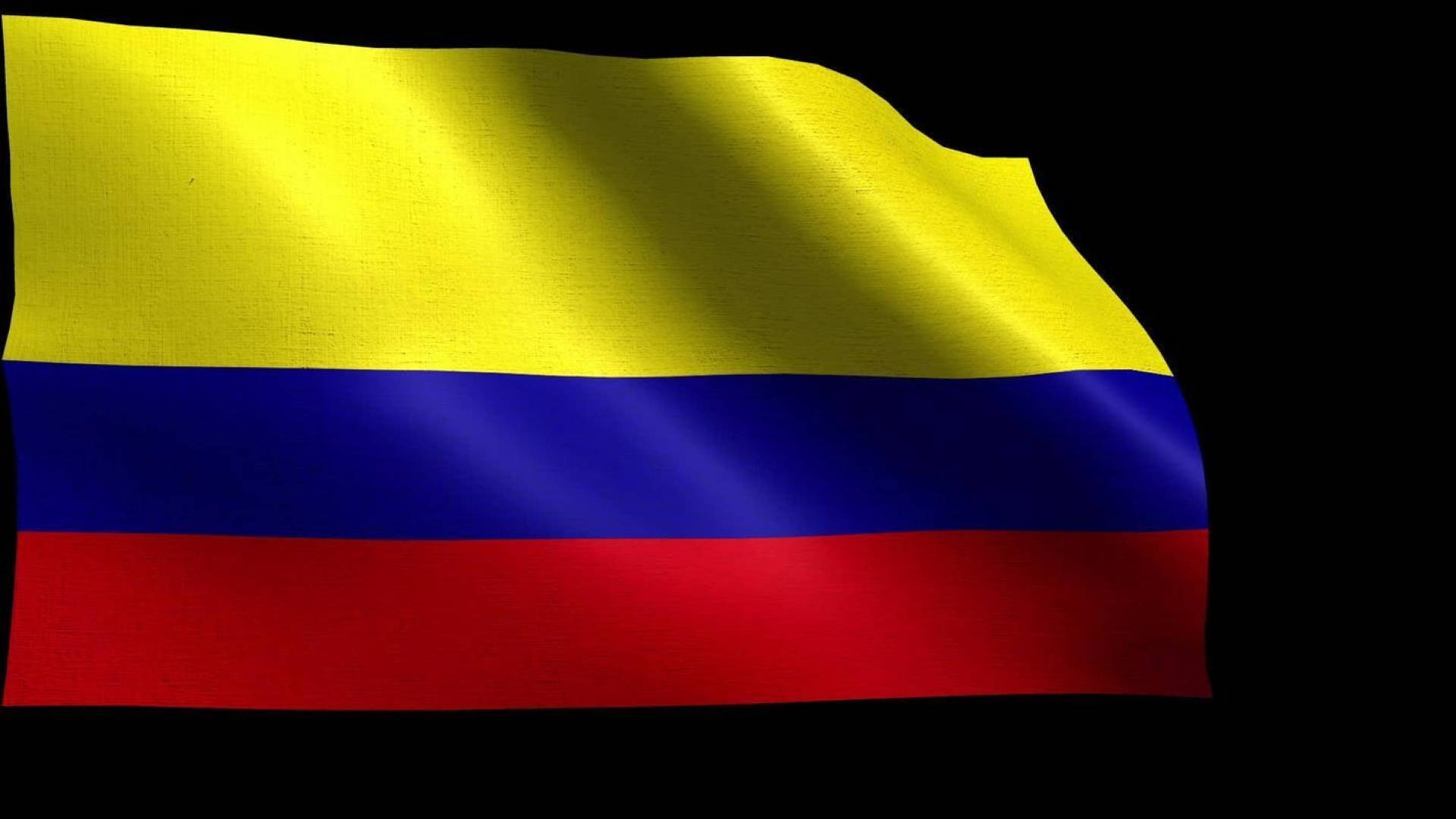 Colombia Flag 桌布 壁紙 — 哥倫比亞國旗在純黑背景上動態飄揚，其黃、藍、紅條紋質感鮮明。