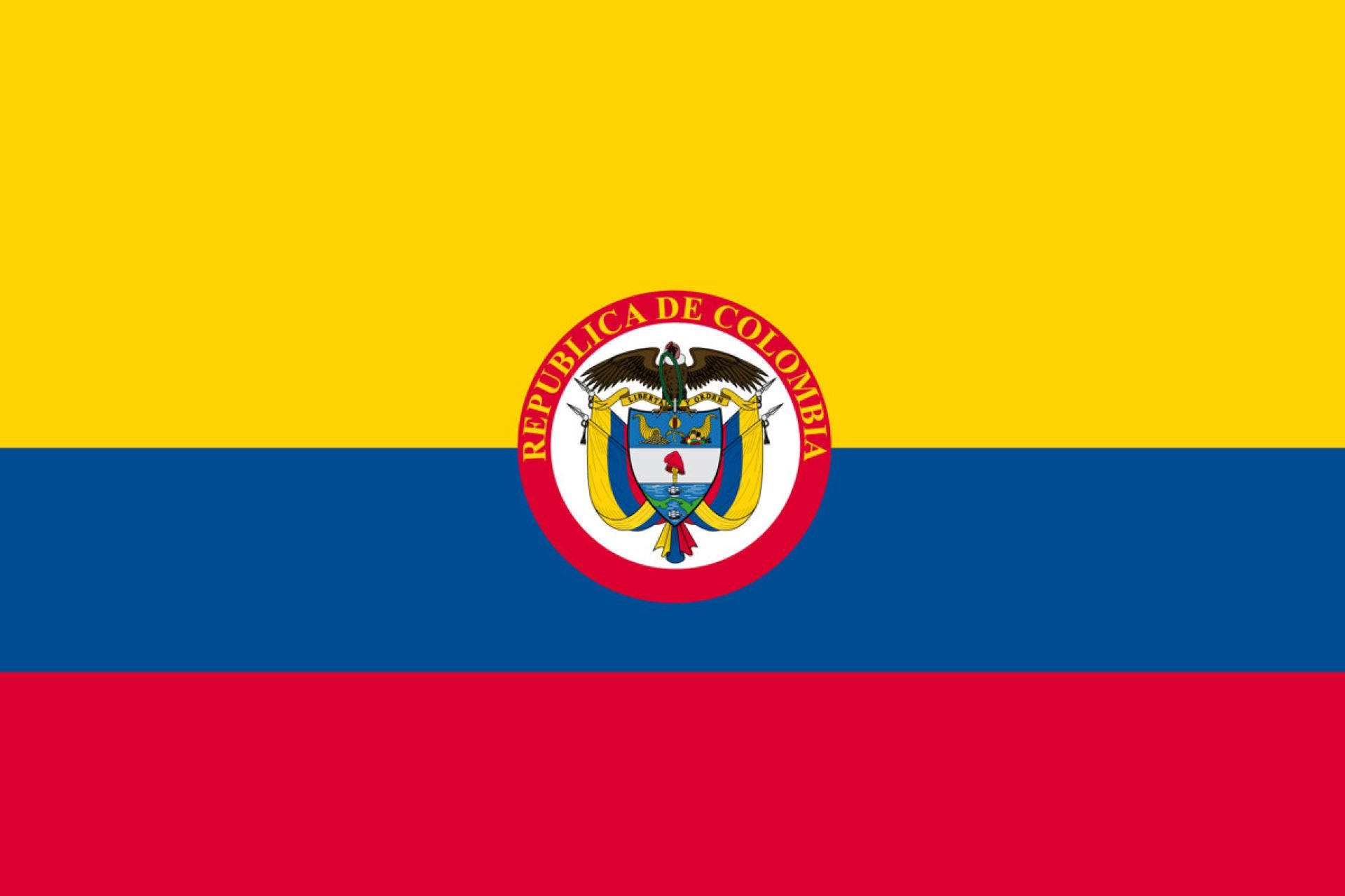 Colombia Flag 桌布 壁紙 — 哥倫比亞國旗採用黃、藍、紅橫條，中央有國徽，展示一隻金鷹持盾。