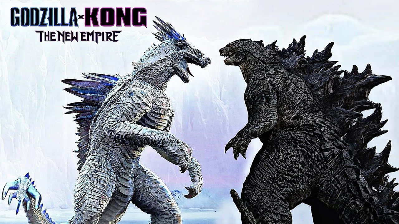Godzilla X Kong The New Empire 桌布 壁紙 — 哥吉拉和金剛在戲劇性的冰雪景觀中對峙，有積雪覆蓋的懸崖和哥吉拉翅膀上發光的藍色點綴。