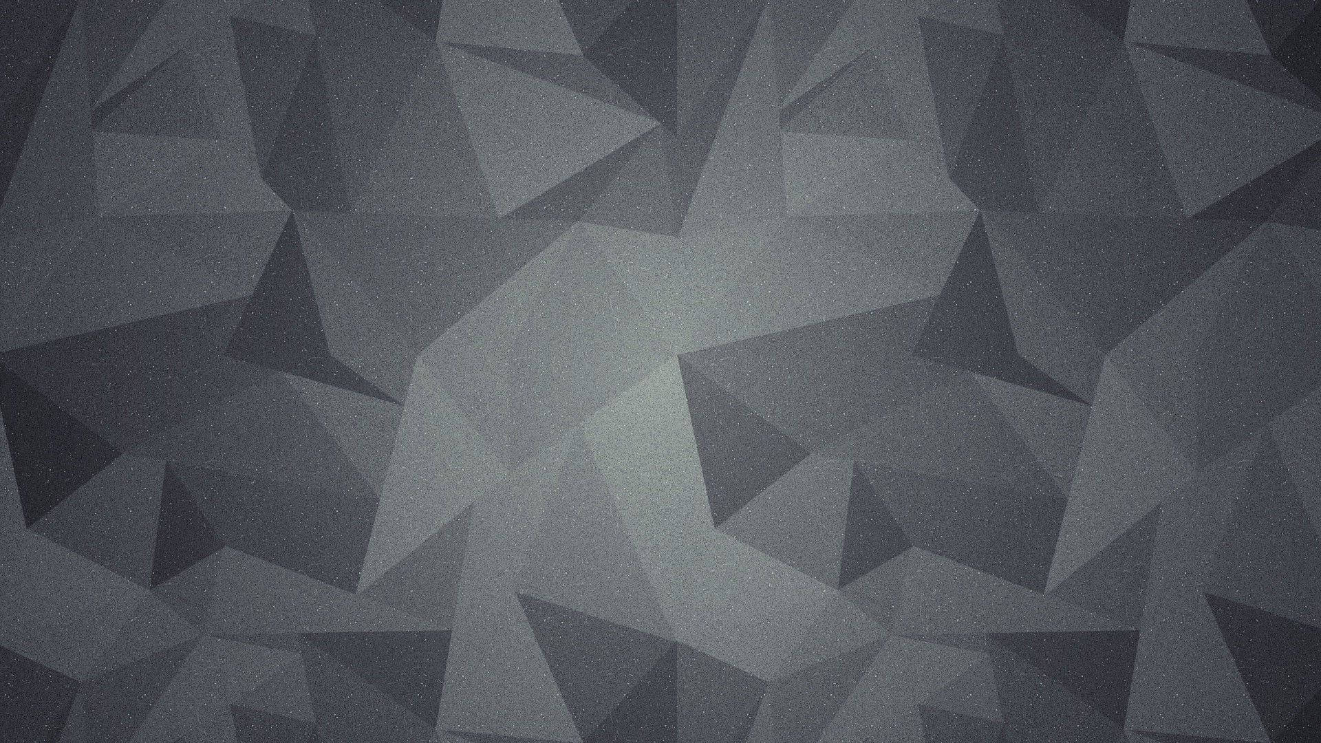 幾何 桌布 壁紙 — 單色幾何圖案壁紙，以不同灰色調的互鎖三角形創造現代抽象圖案。