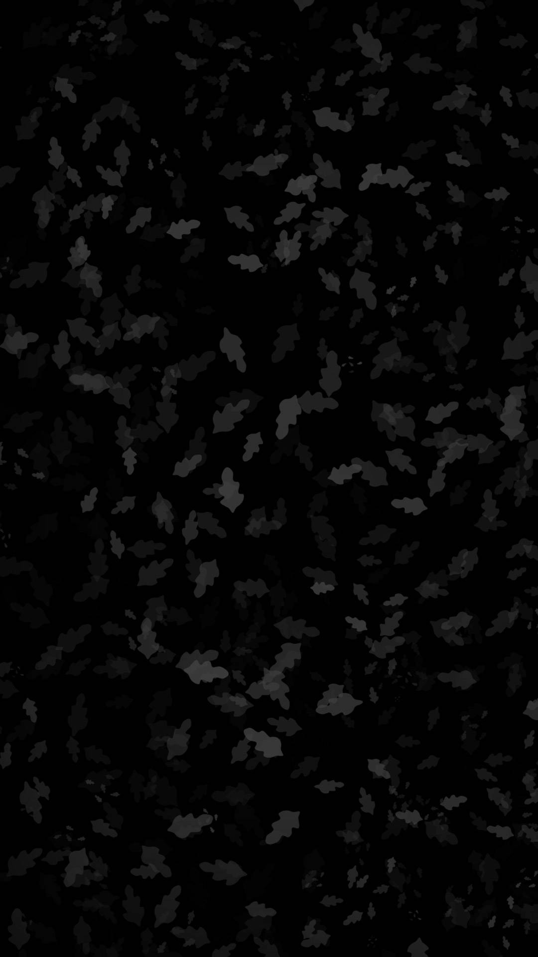 Dark Pixel 桌布 壁紙 — 單色抽象圖案，散落的葉子剪影在深黑色背景上。