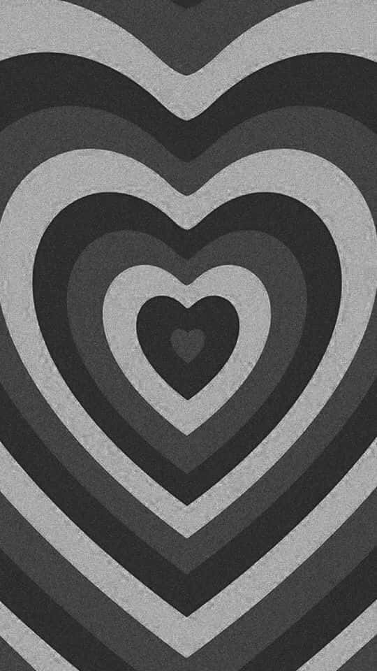 Black And White Heart 桌布 壁紙 — 單色桌布，以不同灰色深淺的同心心形圖案營造催眠視覺效果。