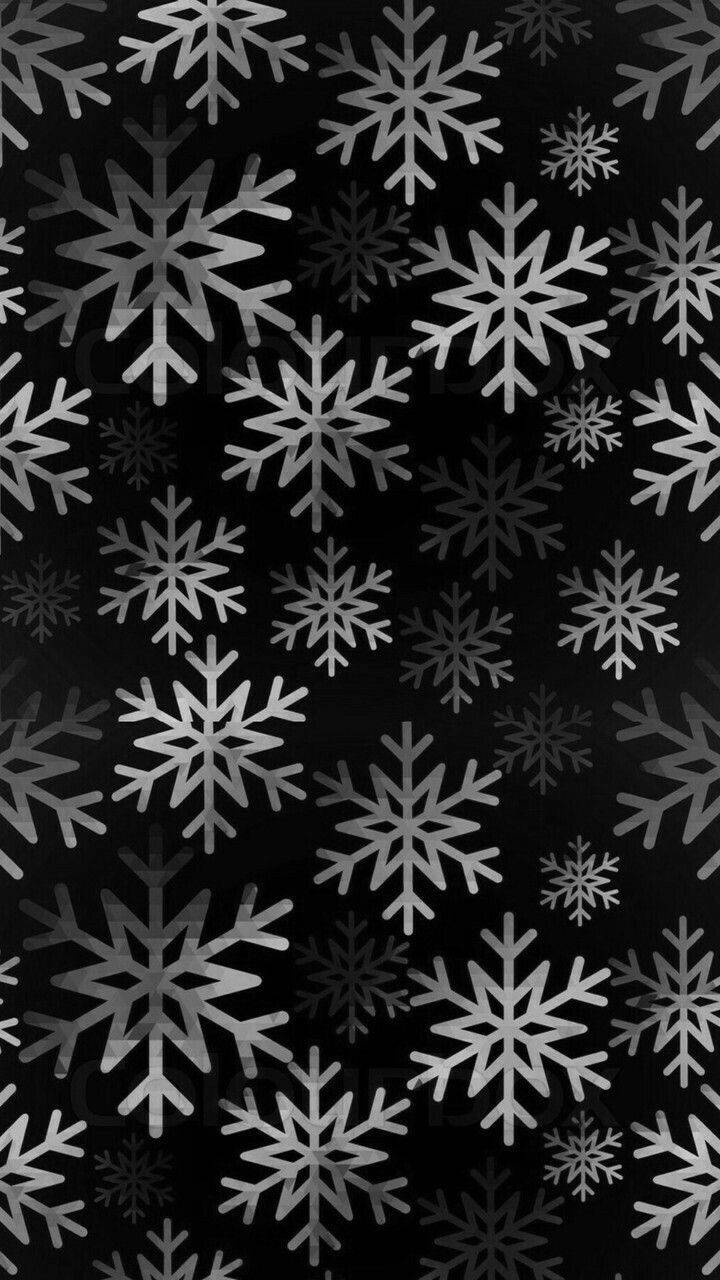 Black Christmas 桌布 壁紙 — 單色桌布，在純黑色背景上散落著各種尺寸的精緻銀色雪花。