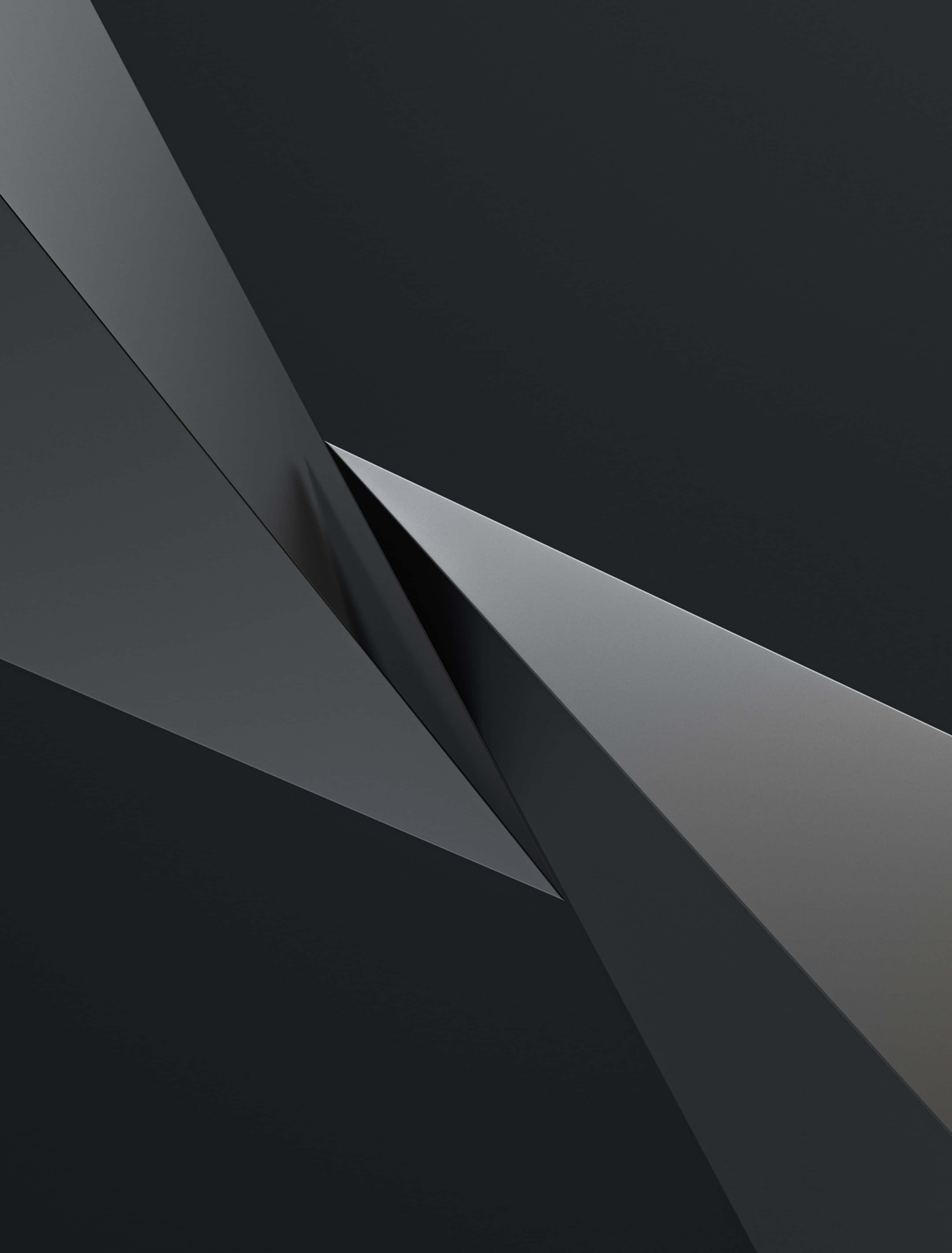 Gray Gradient 桌布 壁紙 — 單色灰色中的銳利幾何平面營造出帶有戲劇性陰影的極簡抽象構圖。