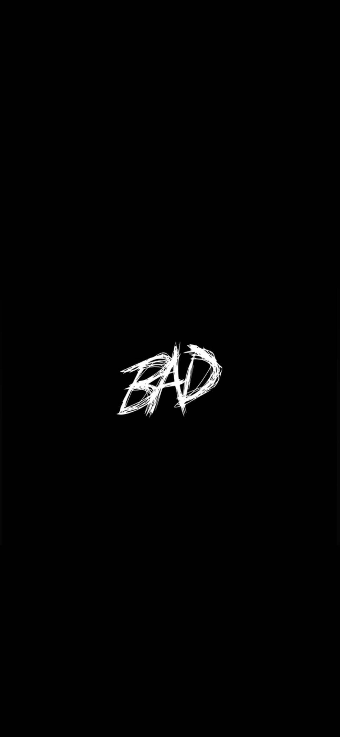黑白 桌布 壁紙 — 單詞「BAD」以粗體白色塗鴉風格字體居中顯示在純黑色背景上。