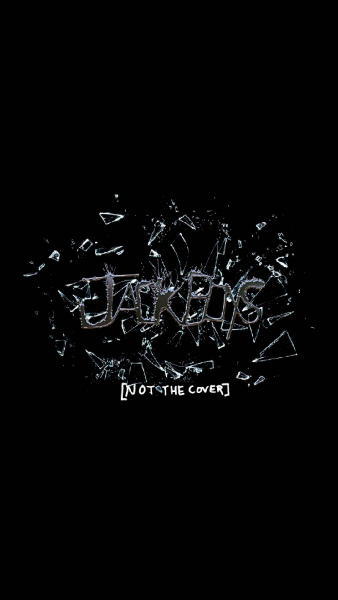  壁紙 — 單詞 JACKETS 像玻璃一樣碎裂在黑色背景上，下方文字寫著 NOT THE COVER。