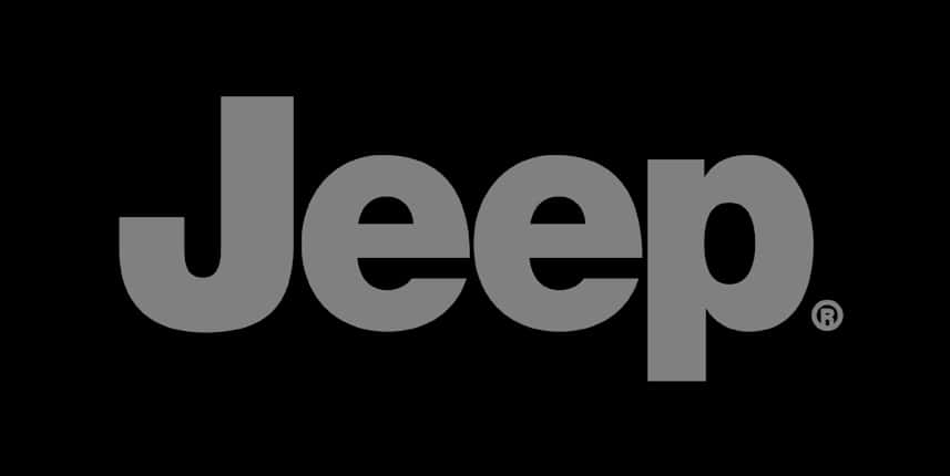 吉普 桌布 壁紙 — 單詞 Jeep 以粗體灰色字母居中顯示在純黑色背景上。