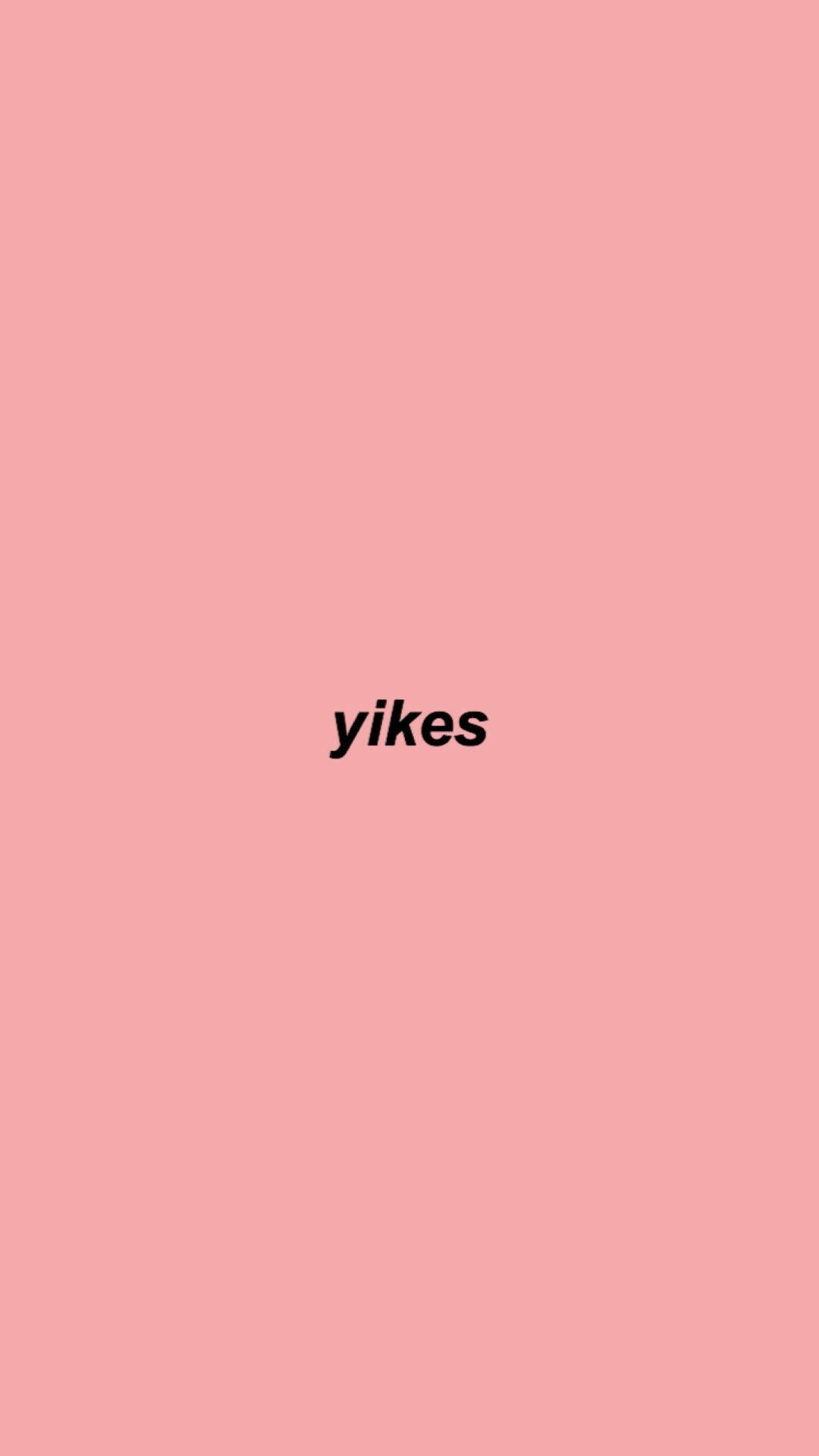 yikes 桌布 壁紙 — 單詞 yikes 以粗體黑色文字居中顯示在純色柔和粉紅色背景上。