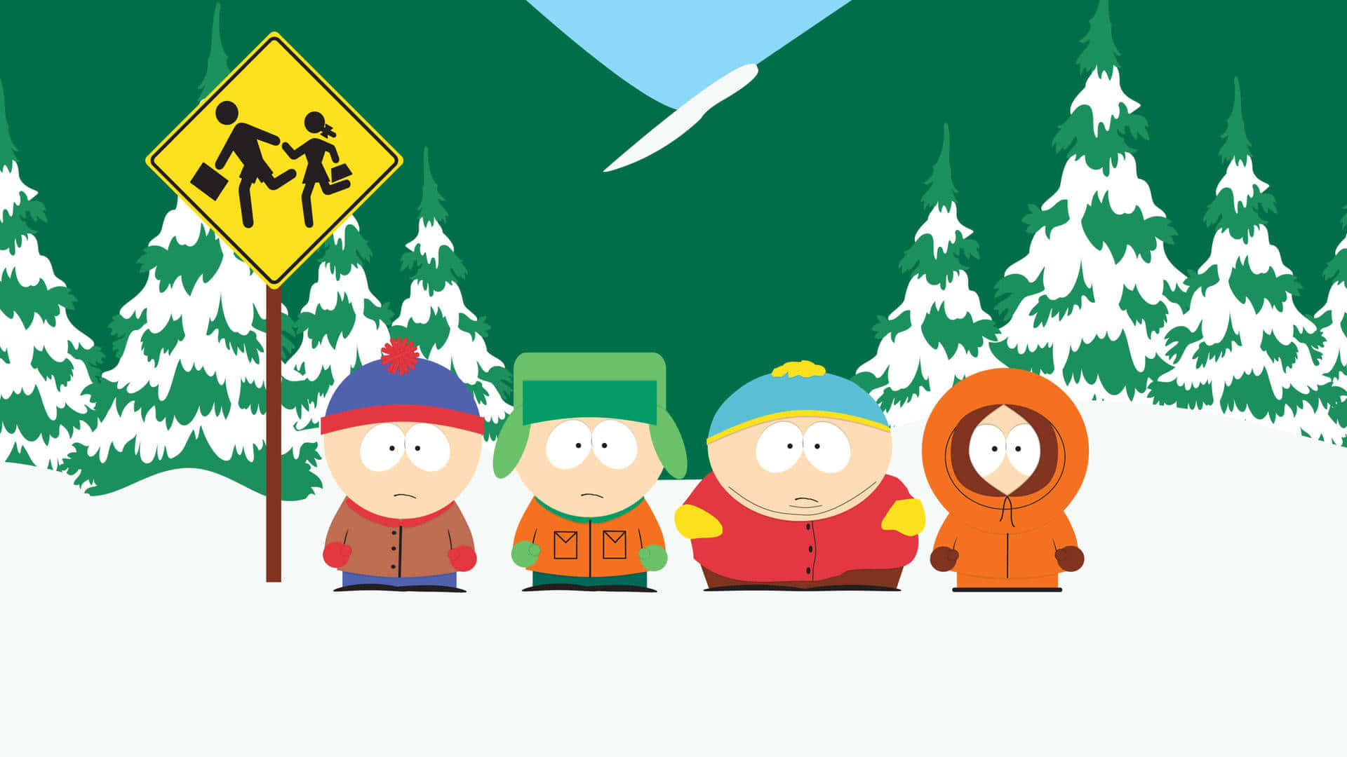 南方公園 桌布 壁紙 — 四個卡通男孩穿著冬季外套站在雪地裡，旁邊有一個行人穿越道標誌，背後有松樹和山脈。