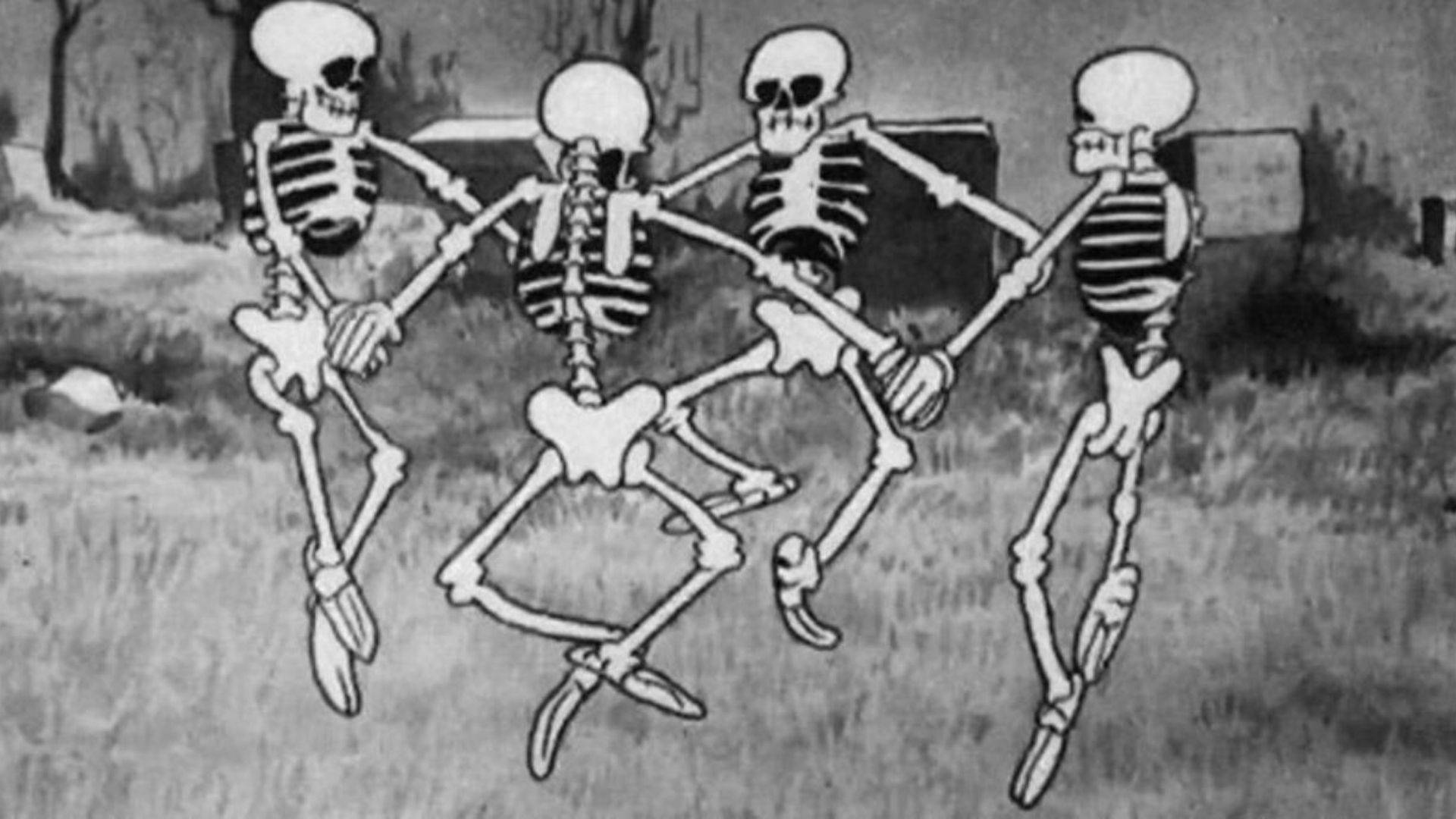 Skeleton Meme 桌布 壁紙 — 四個卡通骷髏在草地上排成一排跳舞，背景有墓碑。