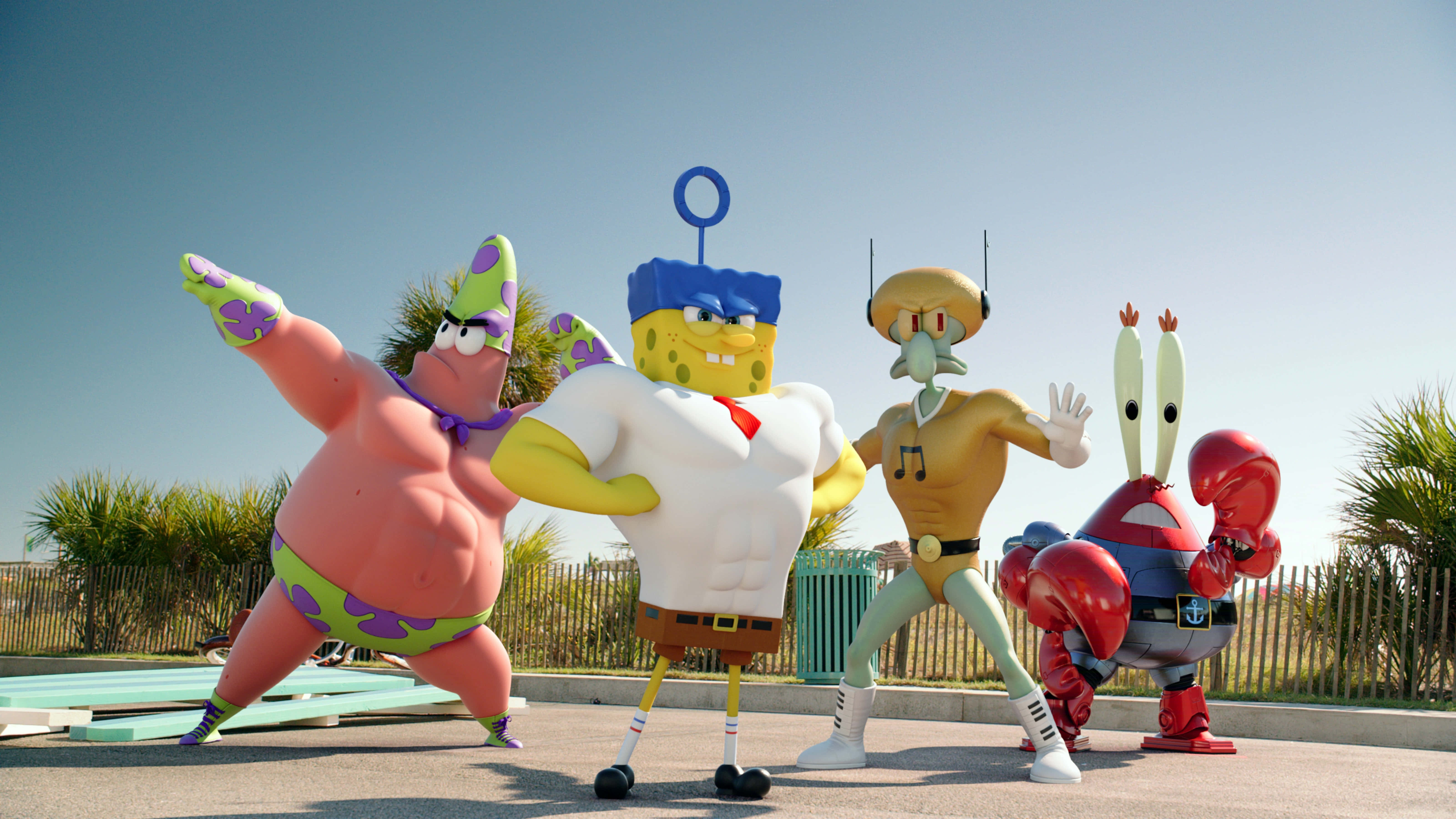Spongebob Characters 桌布 壁紙 — 四個巨大的海綿寶寶角色在晴朗的藍天下以明亮的戶外雕像動態擺姿勢。