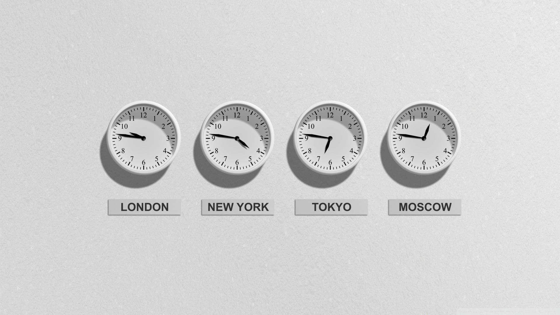 Time 桌布 壁紙 — 四個極簡主義的指針時鐘，標有倫敦、紐約、東京、莫斯科，在純灰色背景上顯示不同的時間。