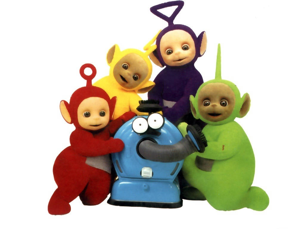 Cartoon 桌布 壁紙 — 四個色彩繽紛的Teletubbies（紅色、黃色、紫色和綠色）圍著一個藍色吸塵器，背景為白色。