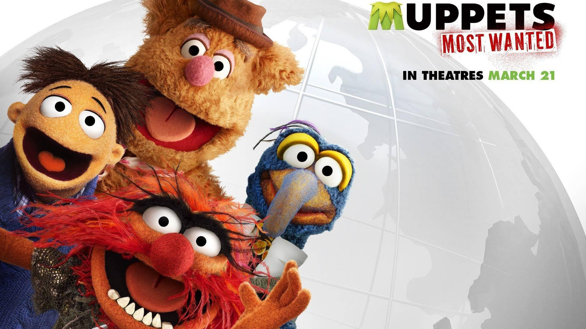 muppets 桌布 壁紙 — 四個色彩繽紛的布偶角色在一個半透明的地球儀前頑皮地咧嘴笑，並帶有電影標題文字。