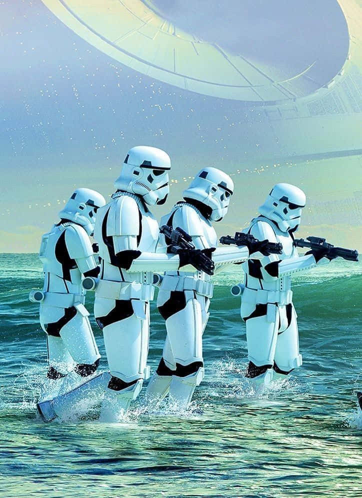 Scarif 桌布 壁紙 — 四個風暴兵涉水而過，手持爆能槍，一艘巨大的太空船在他們頭頂上若隱若現。