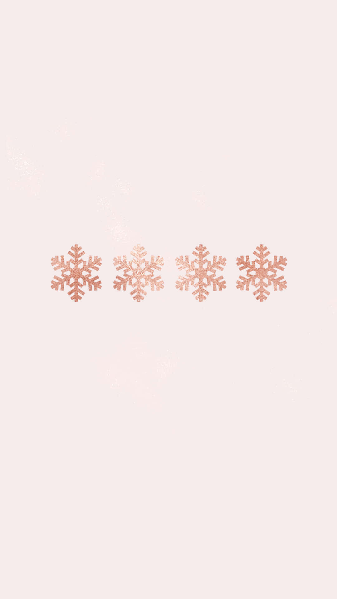桌布 壁紙 — 四片玫瑰金色雪花在柔和的淡粉紅背景上輕輕飄浮，帶有微妙的閃爍雪花點綴。