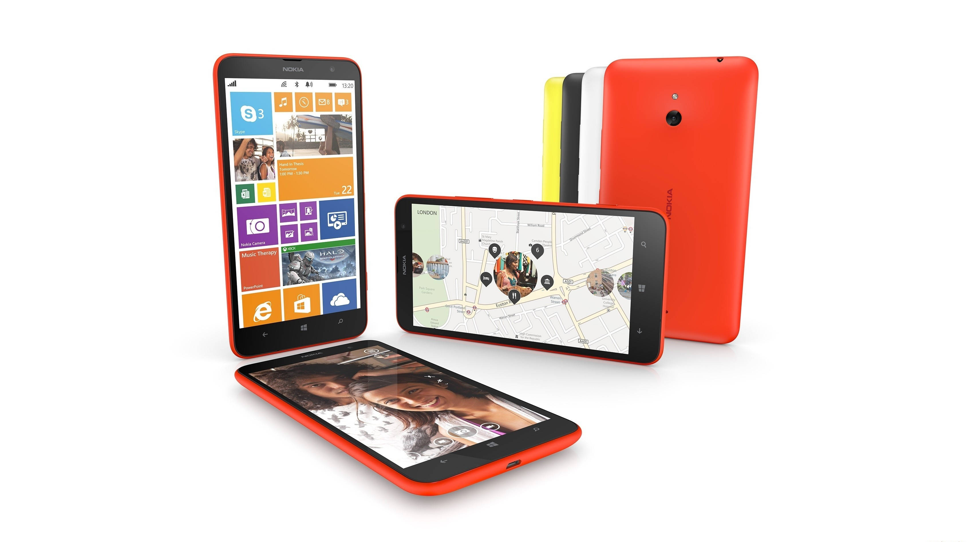 諾基亞 桌布 壁紙 — 四部色彩繽紛的Nokia Lumia智慧型手機以不同角度展示，呈現充滿活力的Windows Phone介面，背景為純白色。