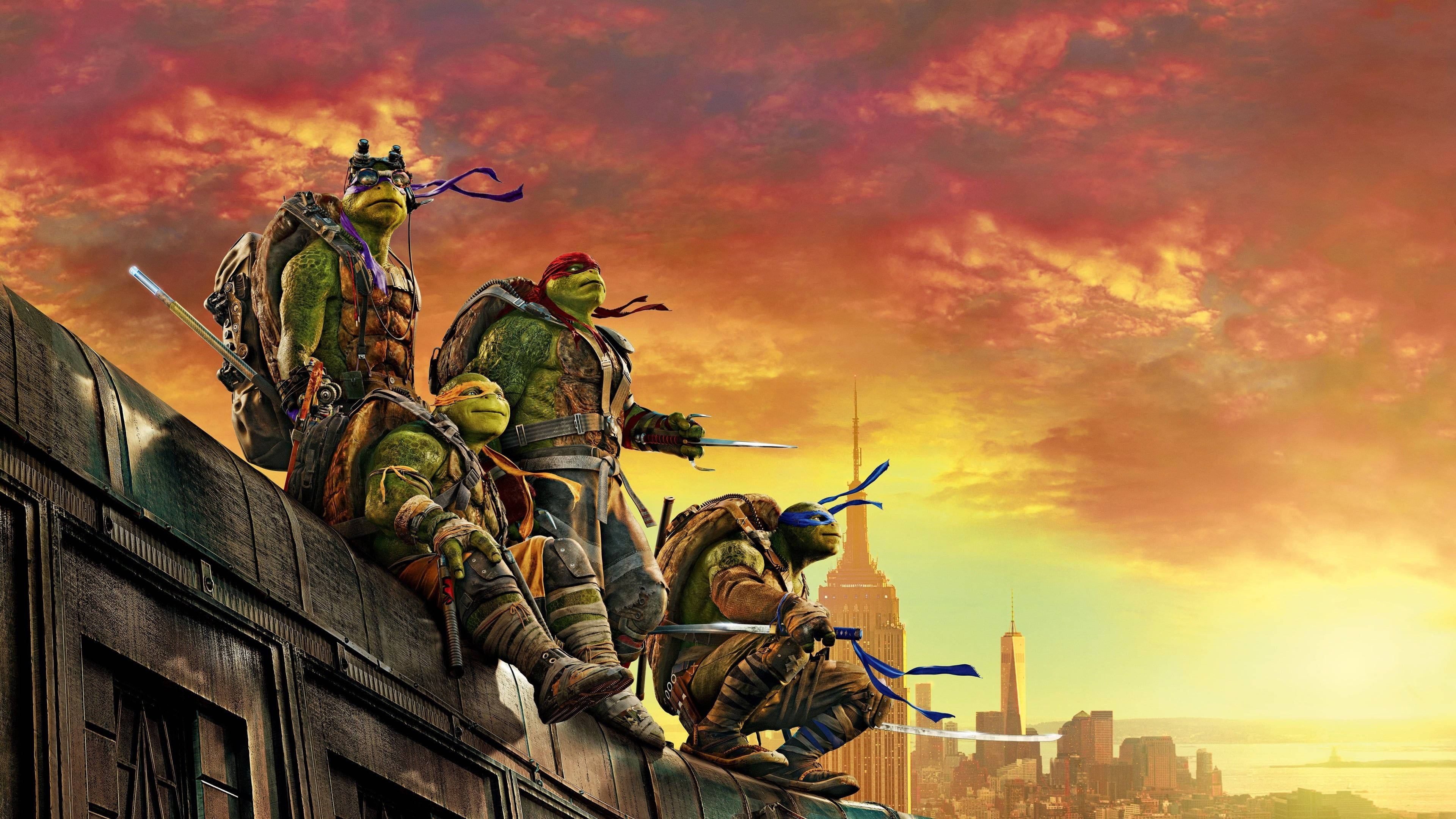 teenage mutant ninja turtles 桌布 壁紙 — 四隻忍者龜棲息在一棟建築物頂部，背景是火紅的夕陽天空和城市天際線。