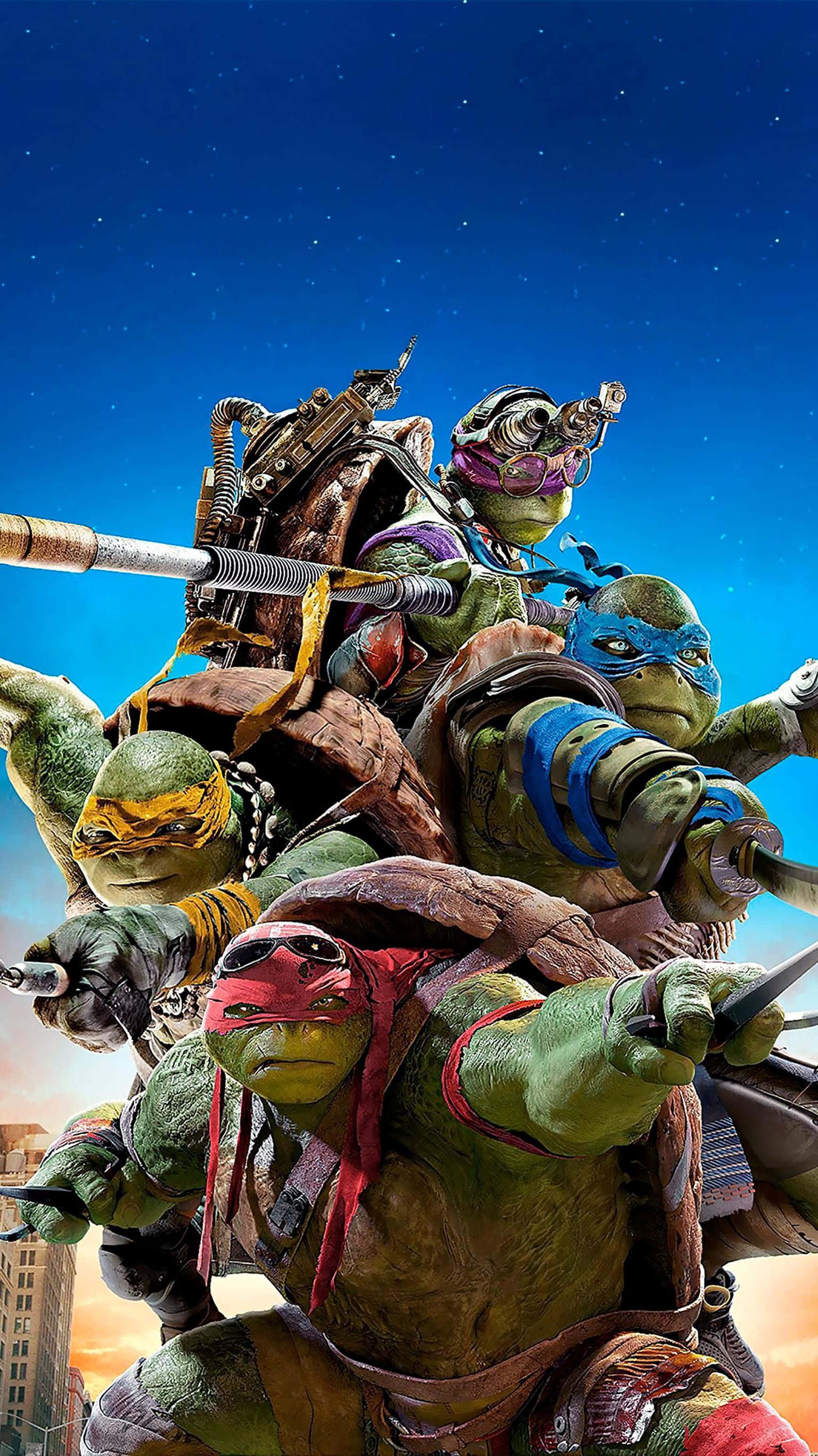 Teenage Mutant Ninja Turtles Comic Book 桌布 壁紙 — 四隻忍者龜身穿戰鬥裝備，在星空夜空和下方城市景觀的背景下英勇地擺出姿勢。