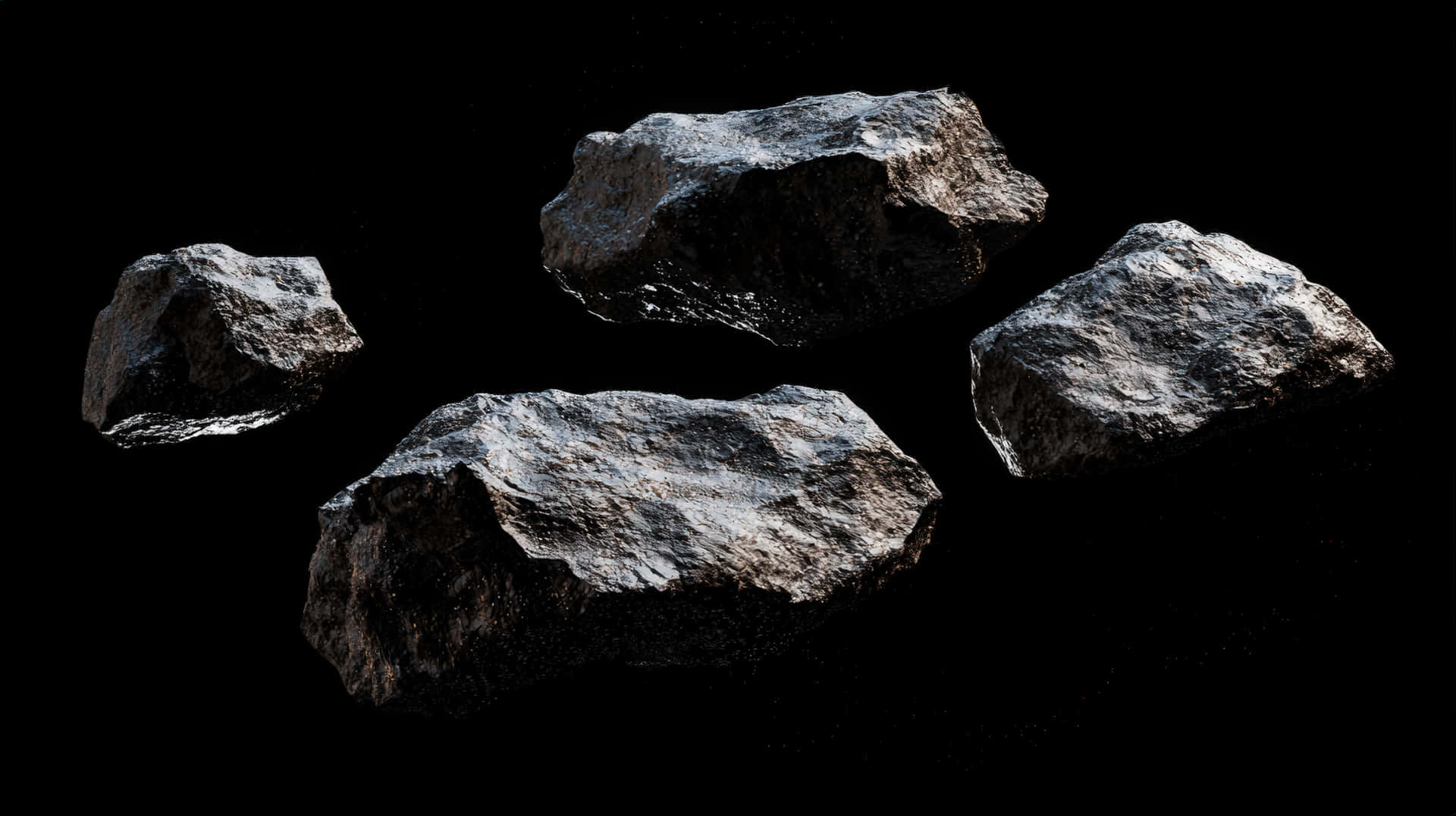 A collection of rocky asteroids floating in deep space against a black background 壁紙 — 四顆堅固的灰色小行星在漆黑無星的虛空中靜靜漂浮，帶有細微的表面紋理。