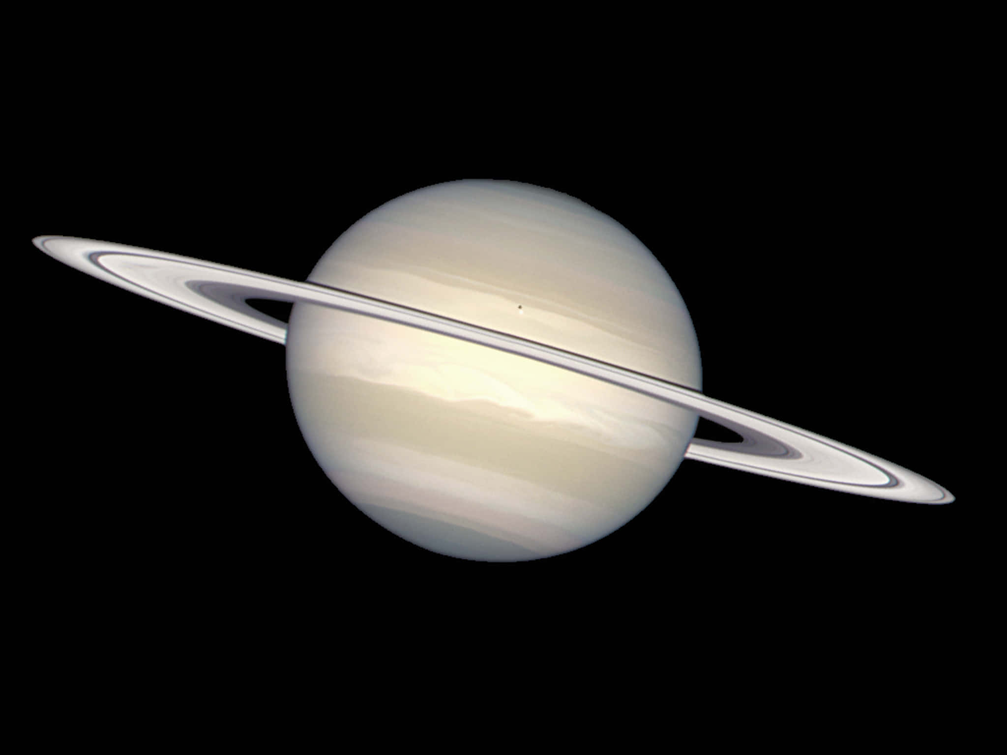 土星 桌布 壁紙 — 土星在虛空中柔和地發光，其標誌性光環在深空中投下細膩的陰影。