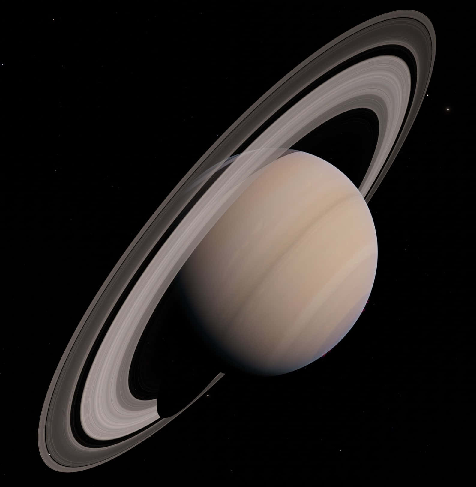 土星 桌布 壁紙 — 土星在虛空中柔和發光，其標誌性光環在深空中投下細膩陰影。