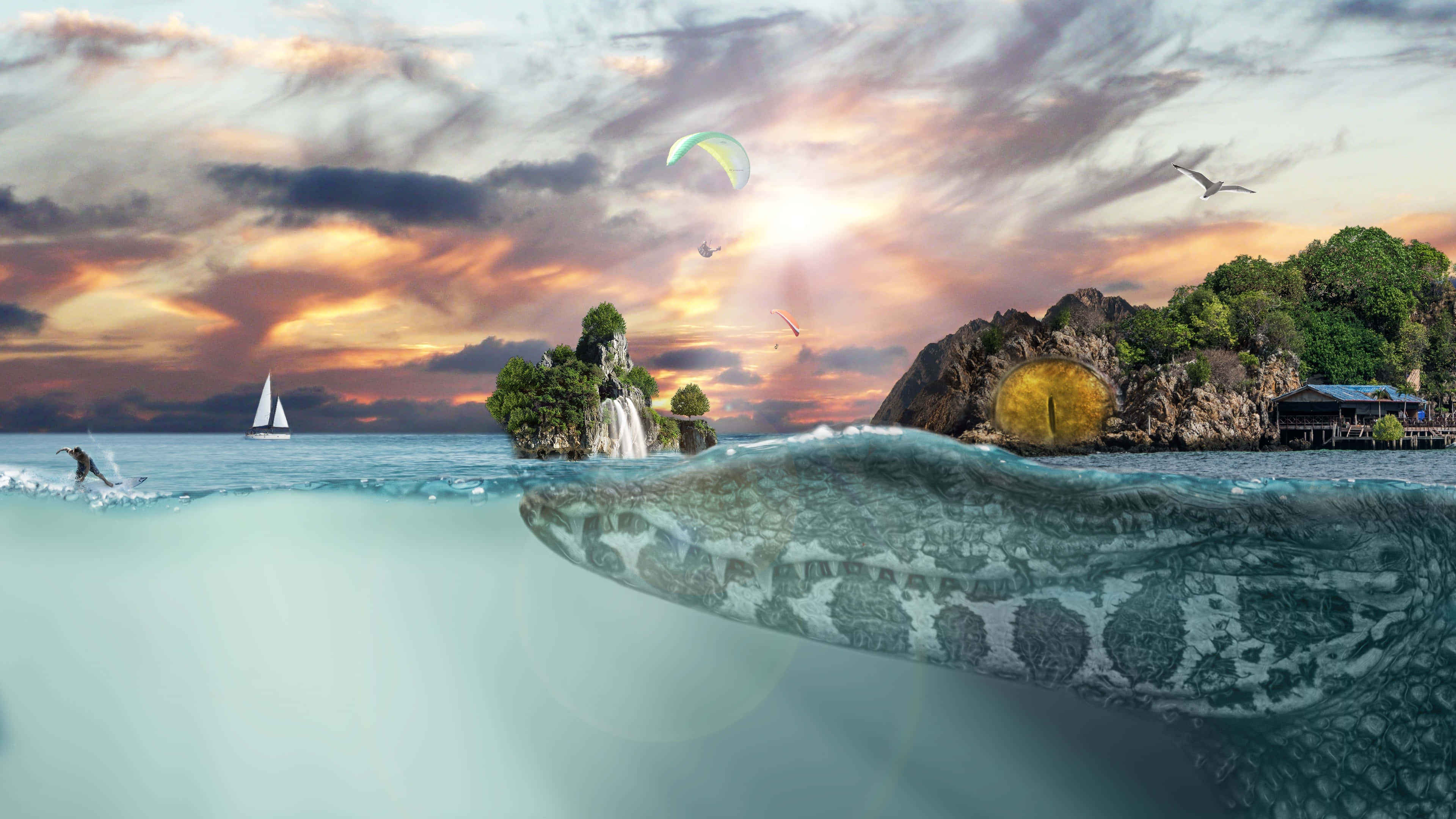 奇幻島 桌布 壁紙 — 在 vibrant 的日落天空下，一隻巨大的短吻鱷從碧綠的海水中浮現，岩石島嶼上方有帆船和滑翔傘。