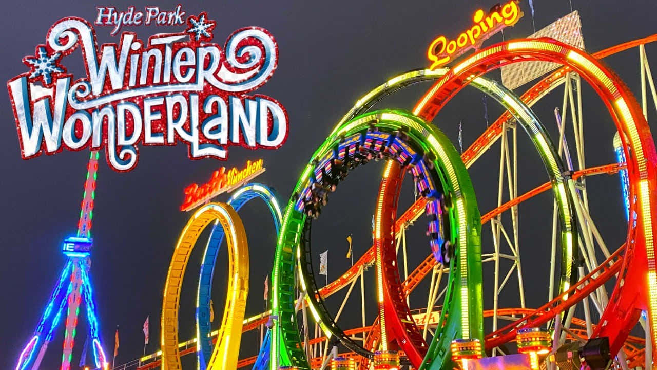冬天 桌布 壁紙 — 在Hyde Park Winter Wonderland，充滿活力的霓虹燈雲霄飛車在漆黑的夜空中扭曲。