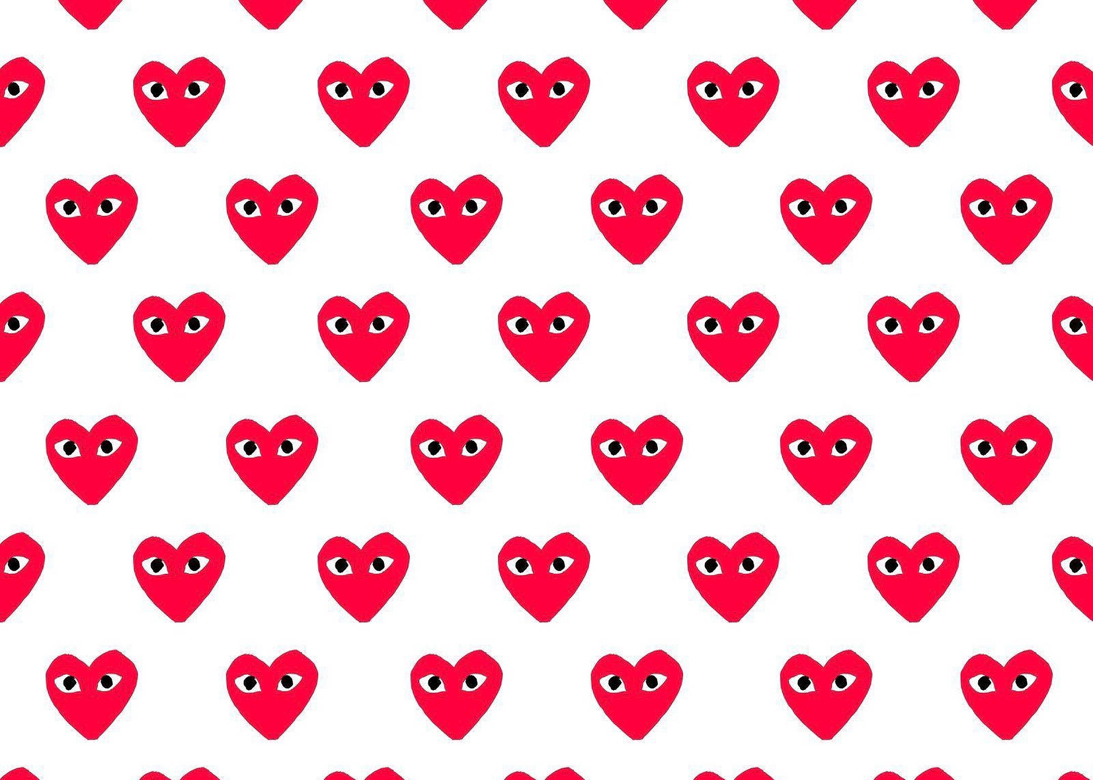 cdg 桌布 壁紙 — 在乾淨的白色背景上重複出現帶有卡通眼睛的鮮紅色心形圖案。