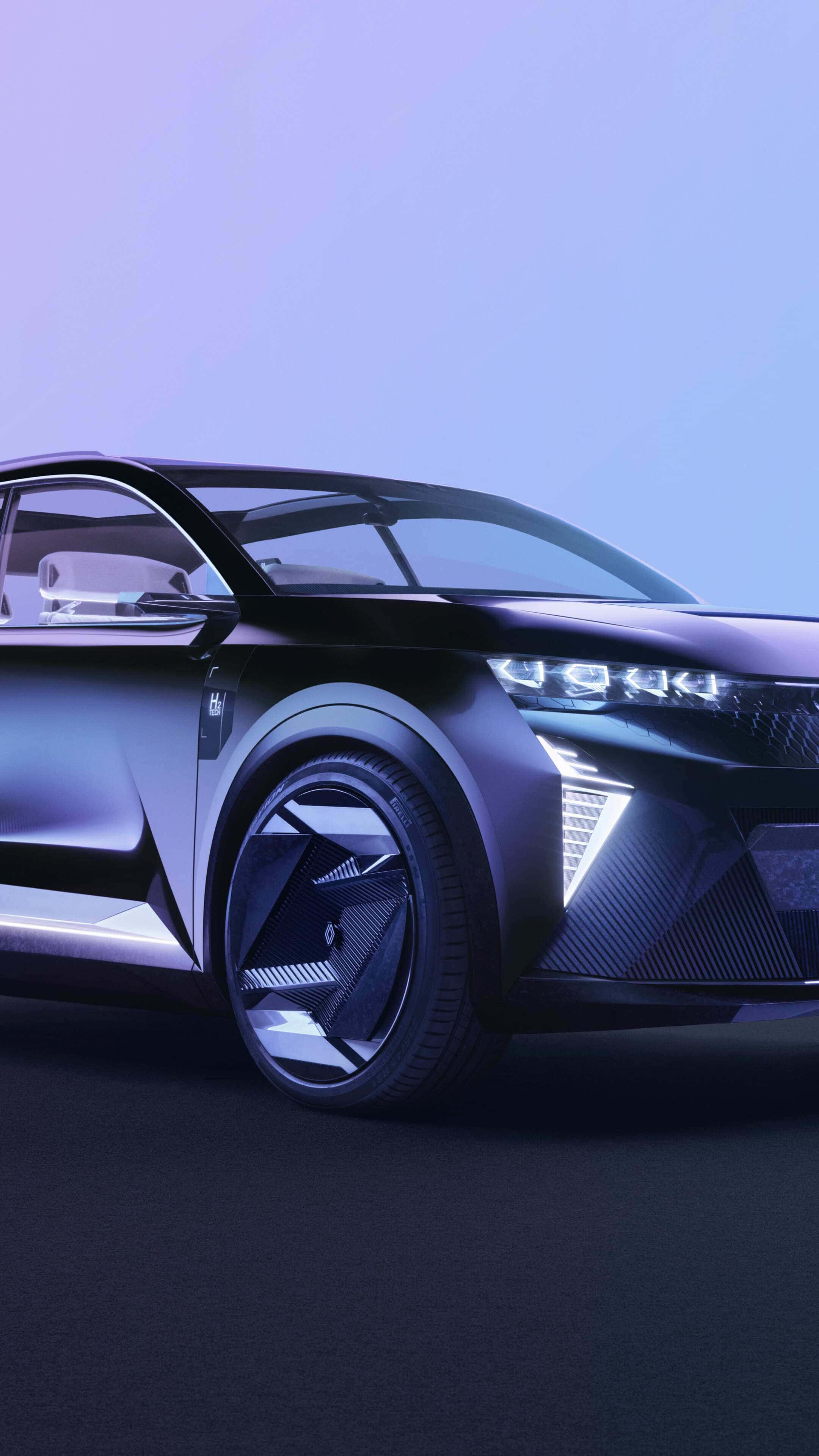 Renault Scenic 桌布 壁紙 — 在冷紫色燈光下，一輛時尚的未來主義黑色汽車，帶有發光的車頭燈和棱角分明的設計。