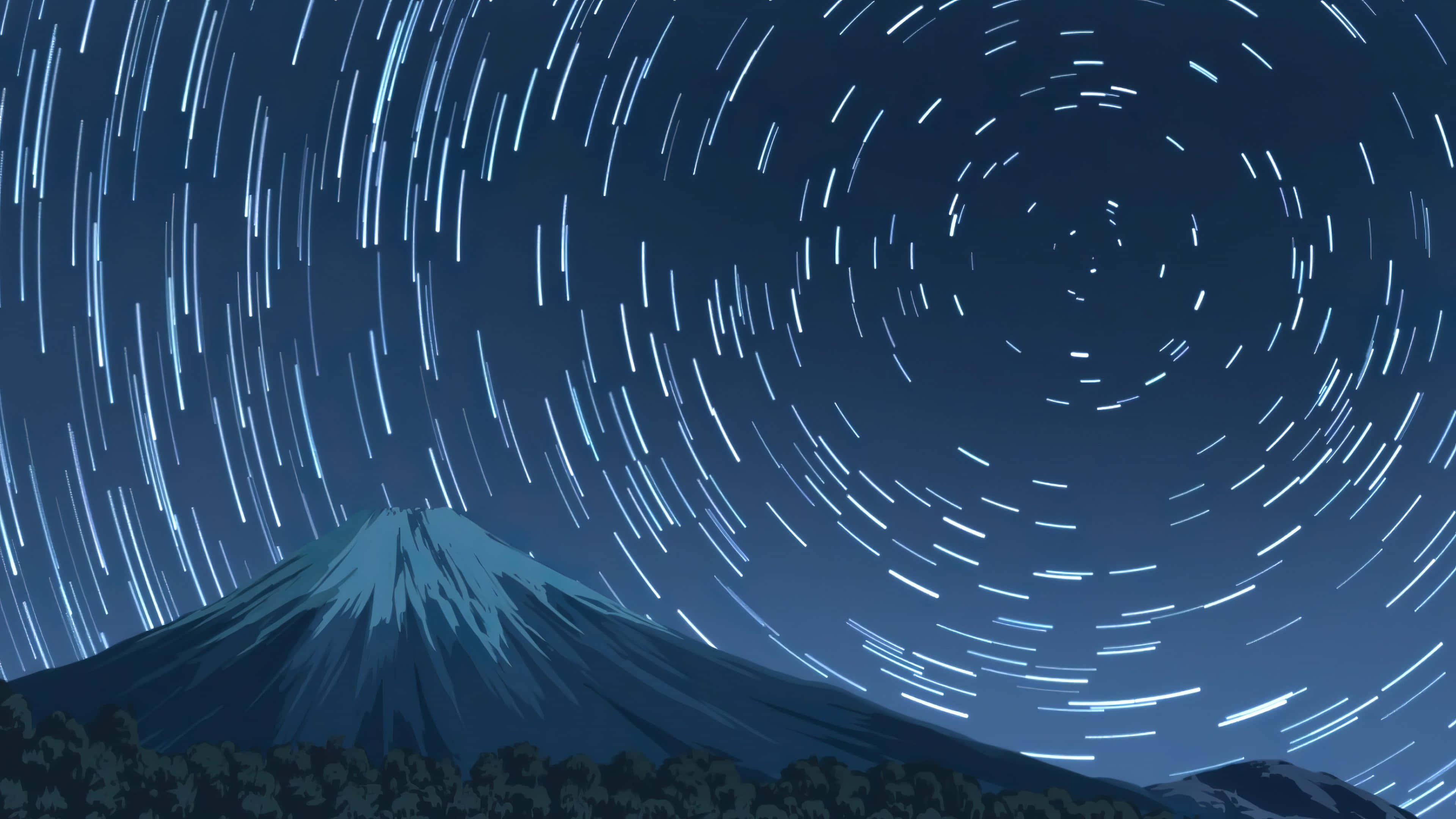 桌布 壁紙 — 在冷藍色調的漩渦星軌夜空下，雄偉的山脈輪廓。