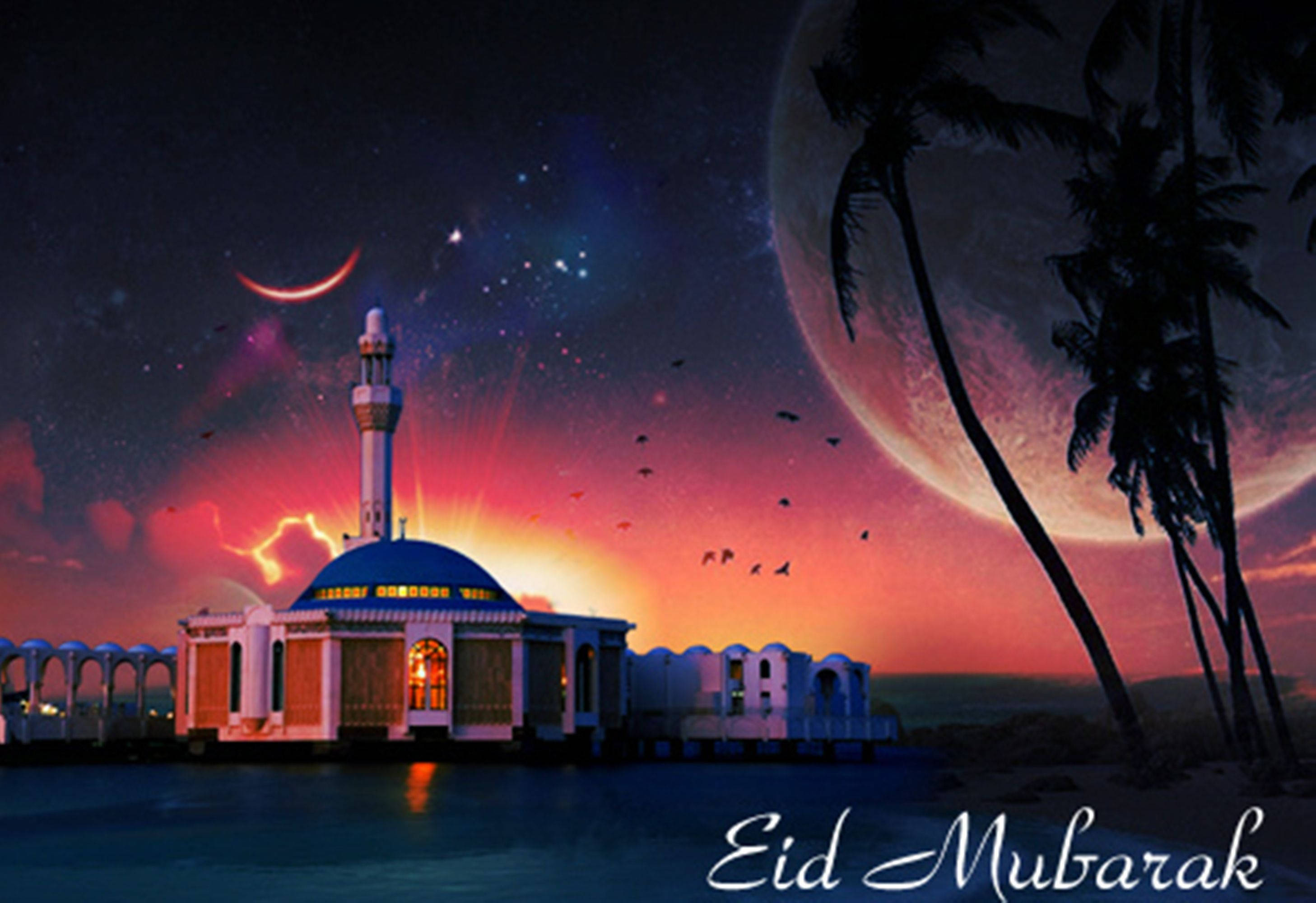 Eid Mubarak 桌布 壁紙 — 在宇宙天空下，水上發光的清真寺，有新月、棕櫚樹和黃昏時飛翔的鳥兒。