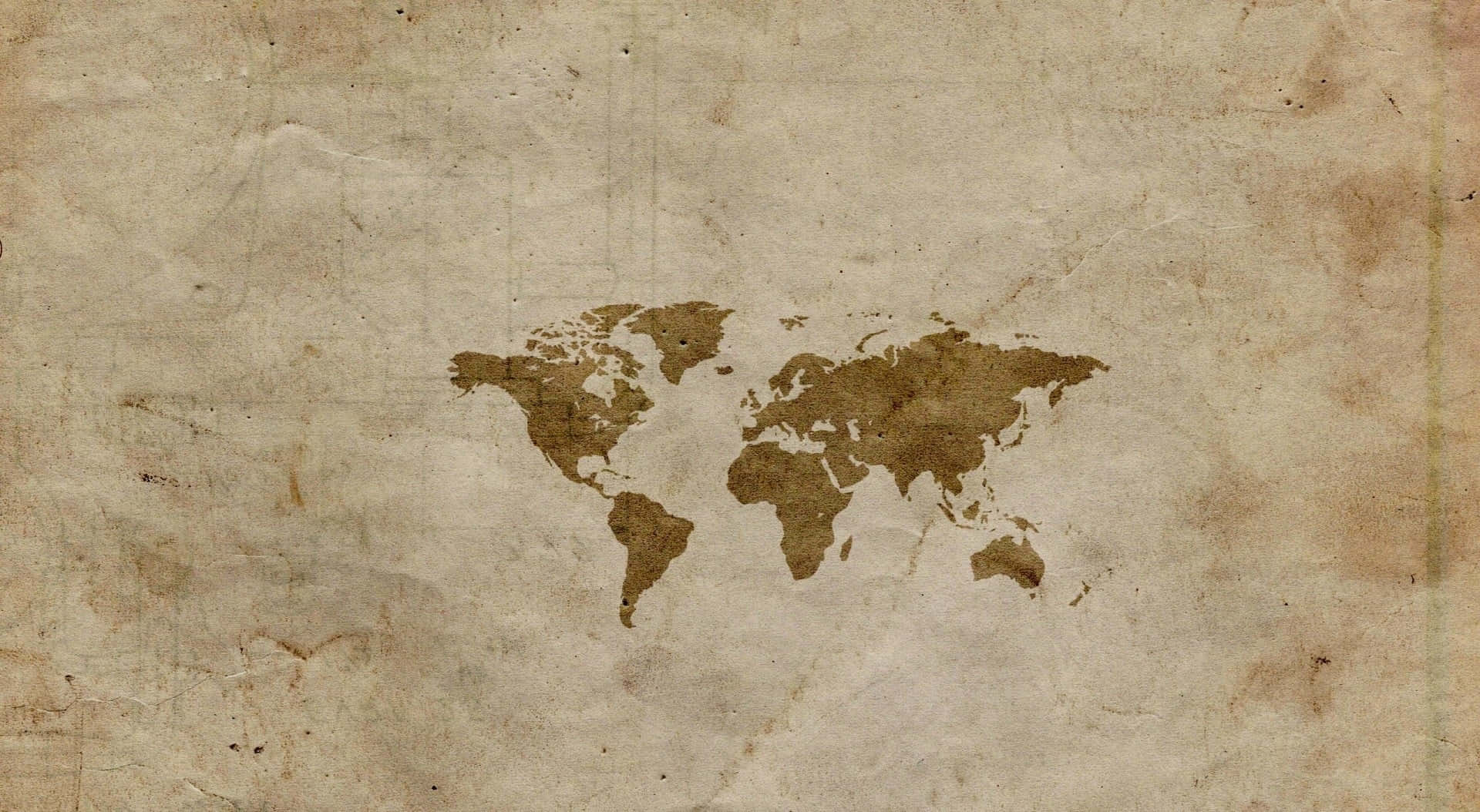 Brown Paper 桌布 壁紙 — 在帶有紋理的陳舊羊皮紙上，以大地棕色調呈現的復古世界地圖剪影。