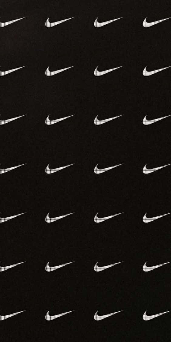 黑色背景上以網格圖案重複出現白色Nike swoosh標誌。 — Nike GIF 壁紙