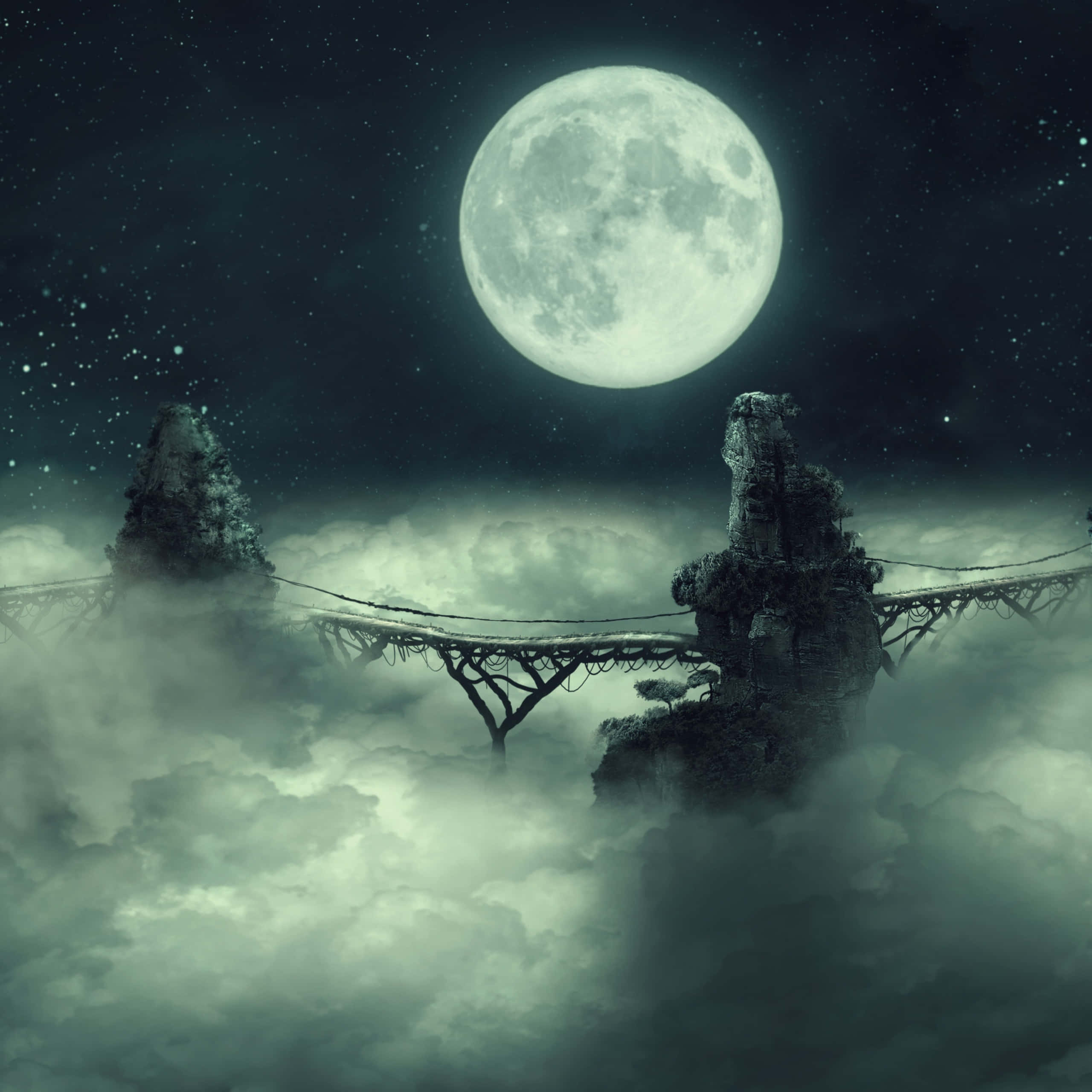 Dark Sky 桌布 壁紙 — 在廣闊的星空下，一座月光照耀的橋樑橫跨在霧氣繚繞的雲層之間，連接兩座岩石尖峰。