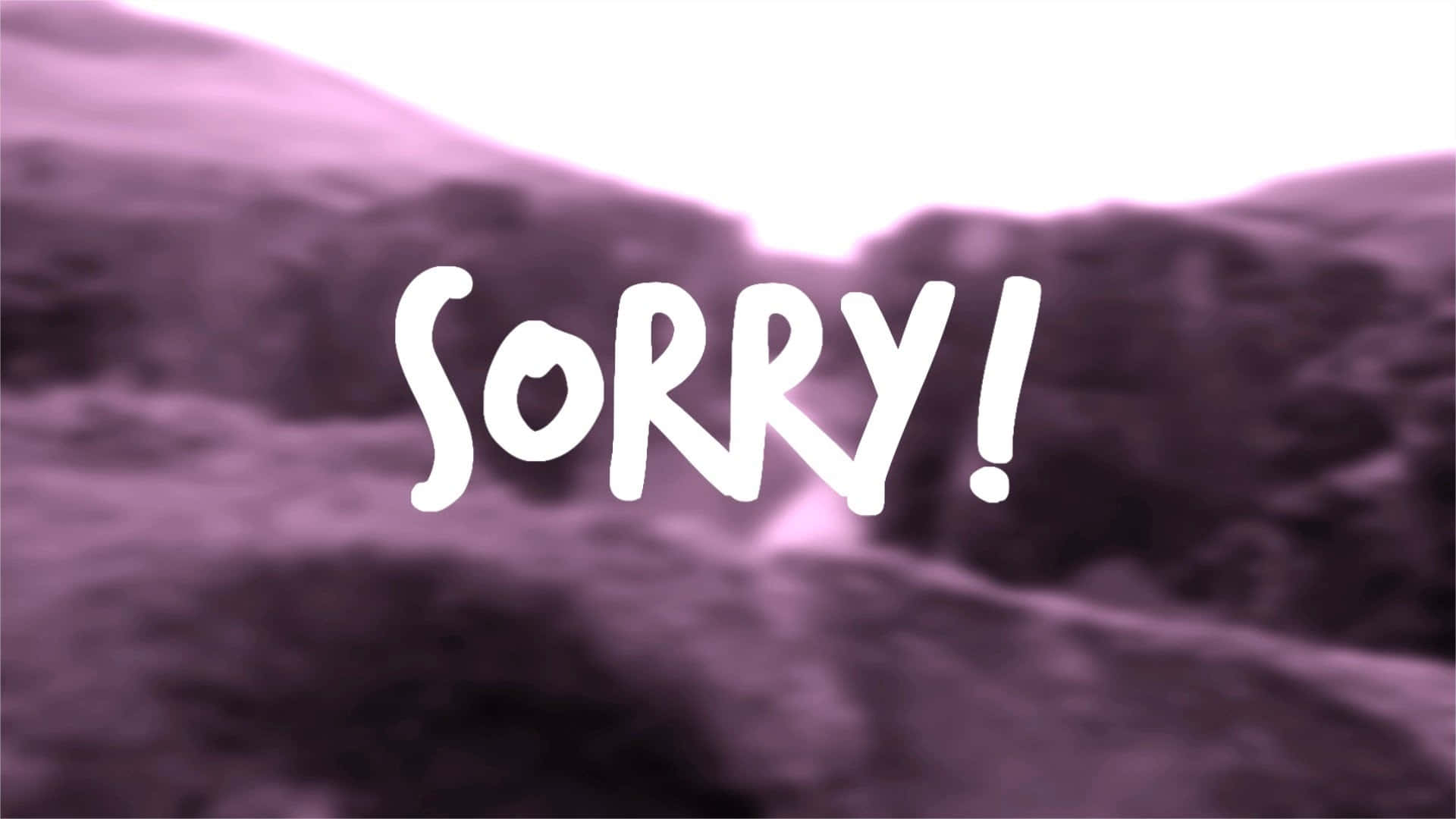text 桌布 壁紙 — 在明亮的天空下，一個大膽的白色「SORRY!」文字疊加在模糊的紫色山景上。