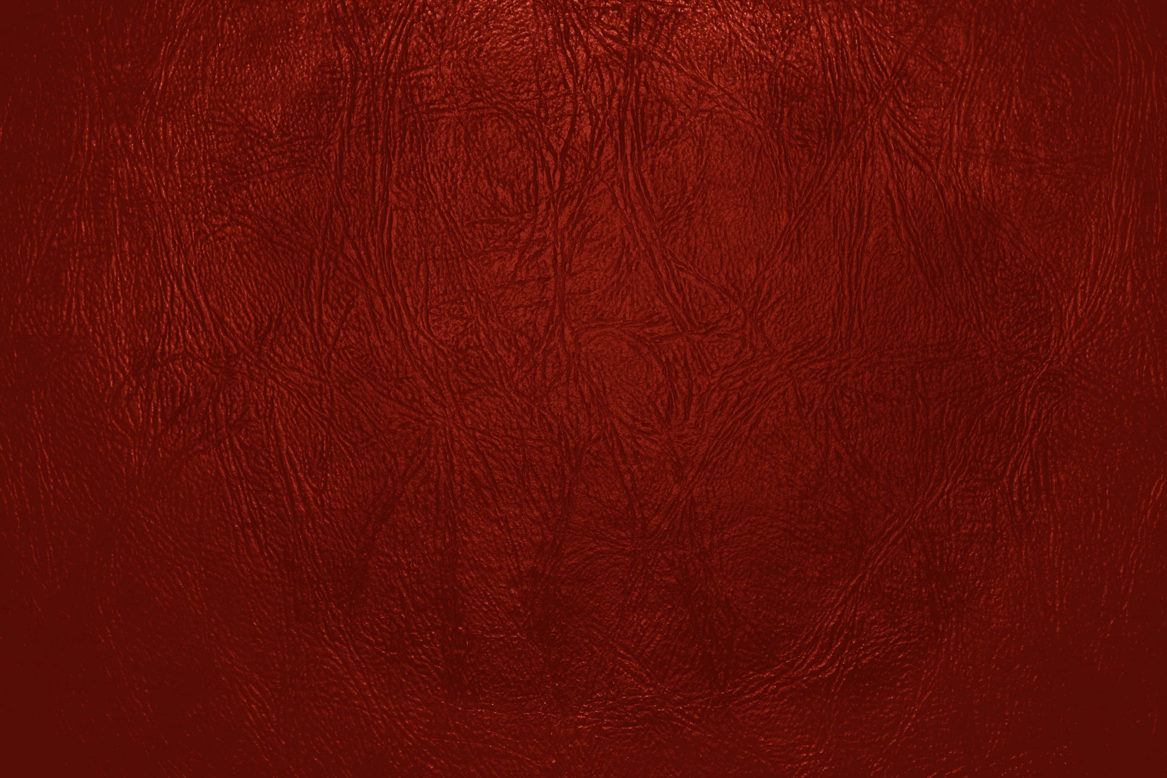 texture 桌布 壁紙 — 在柔和光線下，帶有細微皺褶和天然紋理圖案的豐富深紅色紋理表面。
